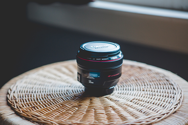This is my favorite lens in the WHOLE WORLD. I love it. I use it for almost everything. It's rare that I have another lens on my camera. It is a Canon 50mm f/1.2L lens. The "1.2" part is key here. That low number refers to the aperture and the lower that number is, the blurrier a background on an image can be. 1.2 is as low as it goes, giving me the creamy & dreamy backgrounds that I love. 