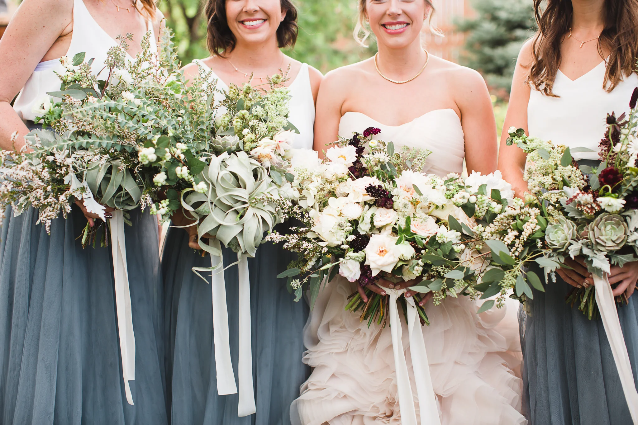 These bouquets by The Daisy Chain are stealing the show in this image. 