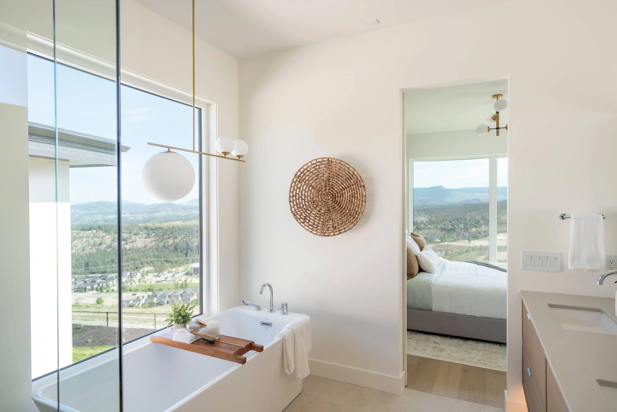 Ensuite with freestanding tub and corner windows, Trailhead Showhome, Kelowna
