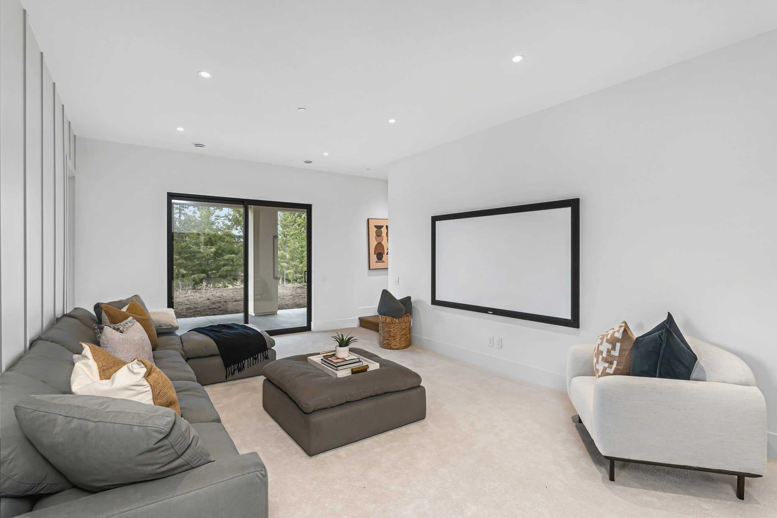 Media room with a projection screen and sectional seating, Ellison Walkout, Predator Ridge