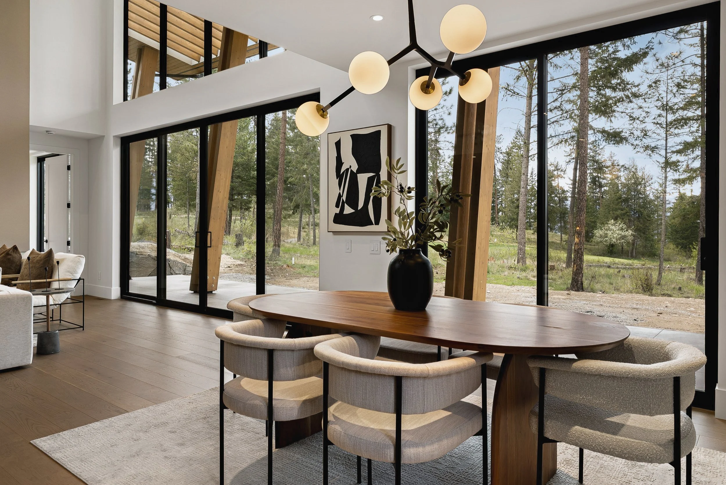 Dining area looking out through sliding glass doors to the trees, Green View Residence, Predator Ridge