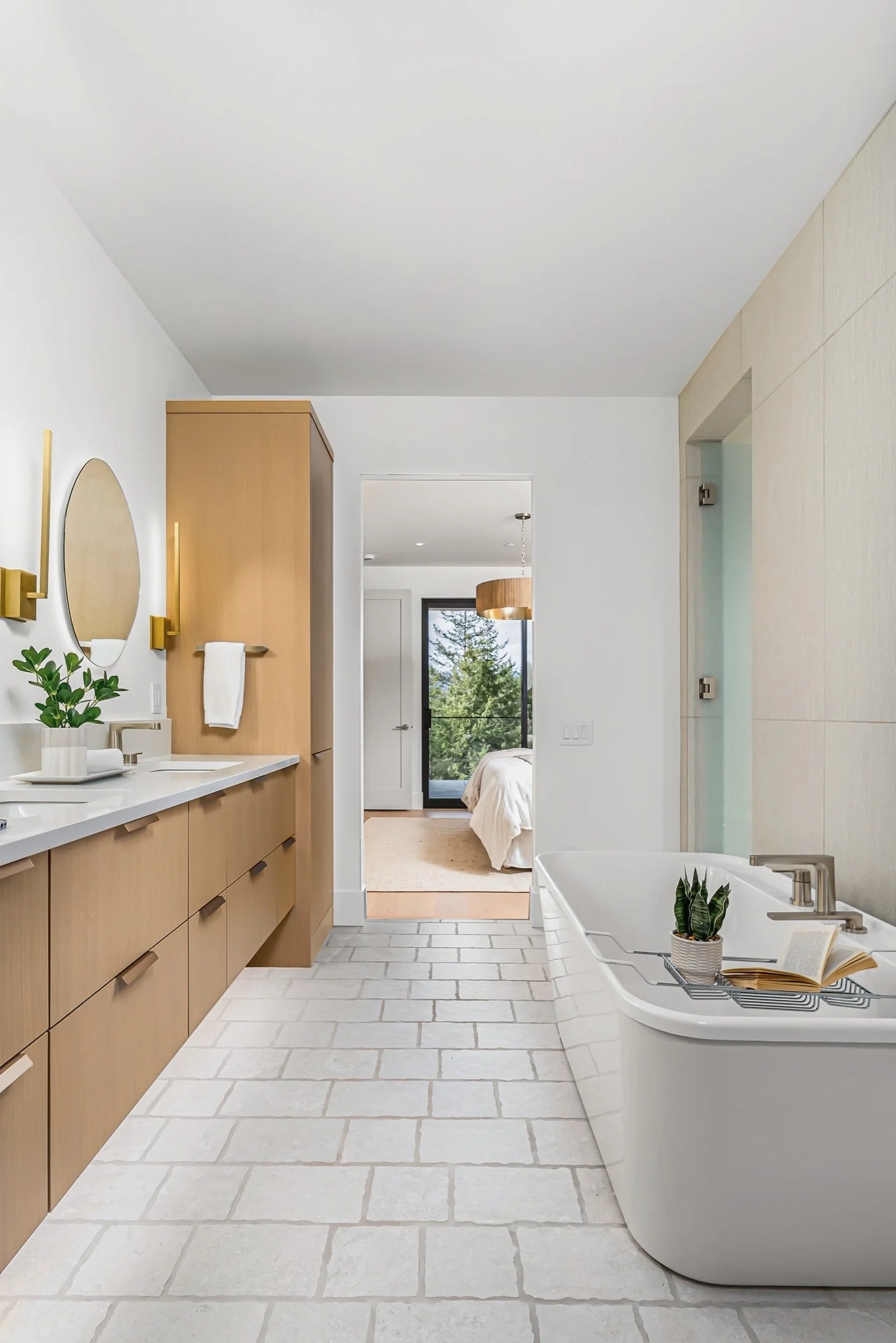 Freestanding tub on a stone-look tile floor in the ensuite, Ellison Walkout, Predator Ridge