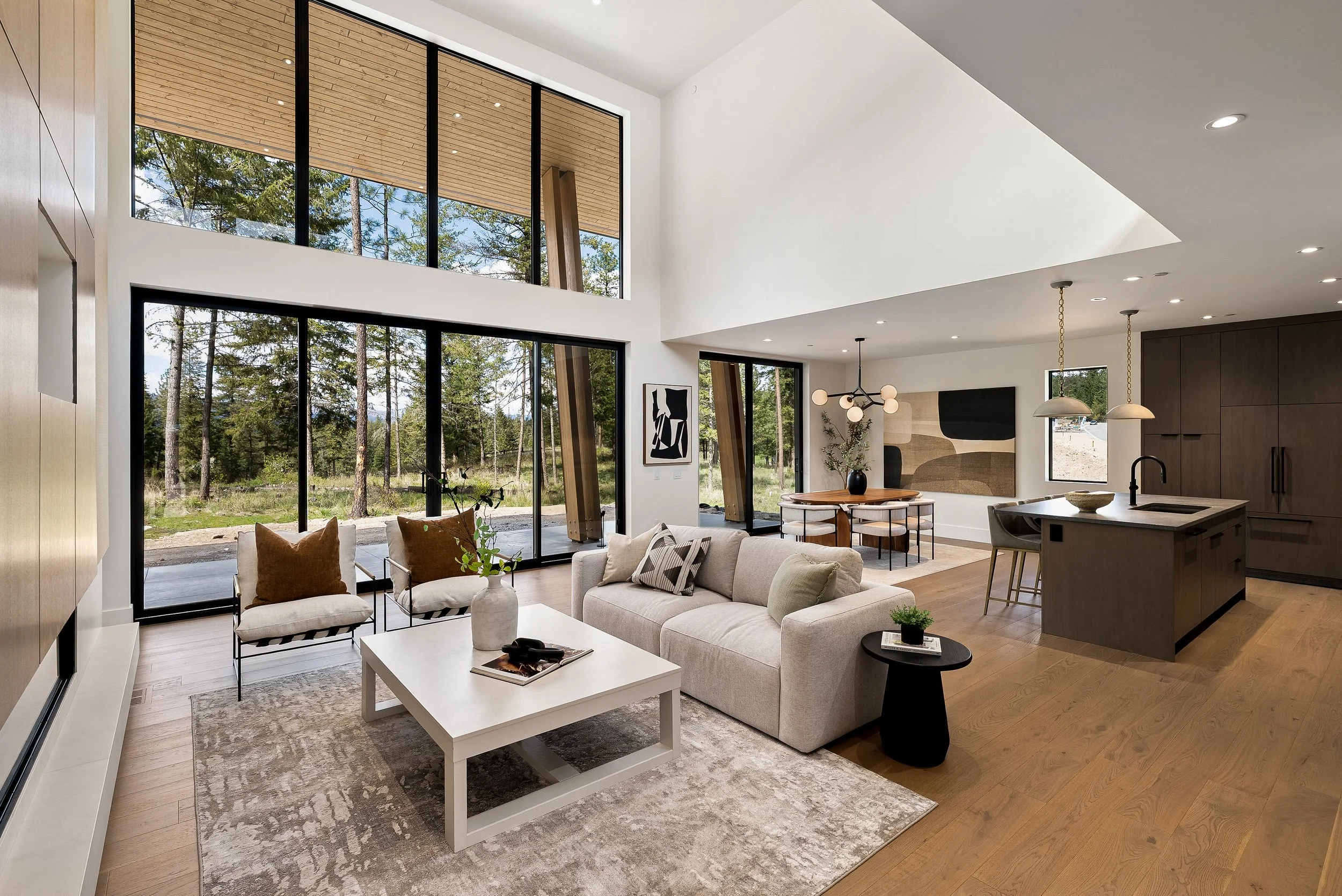 Double-height great room with floor-to-ceiling windows to the golf course, Green View Residence, Predator Ridge