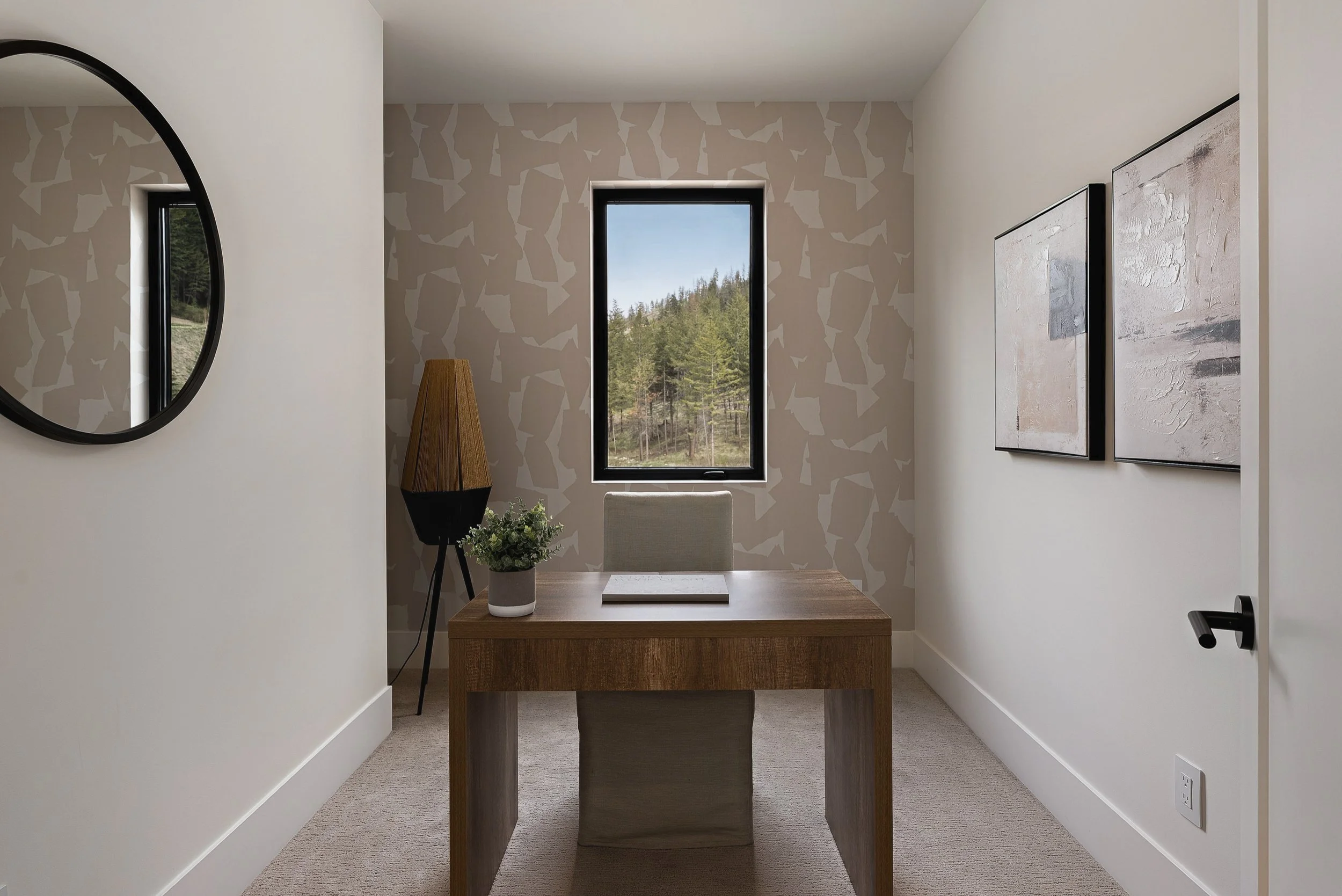 Home office with a wood desk and a window to the trees, Green View Residence, Predator Ridge