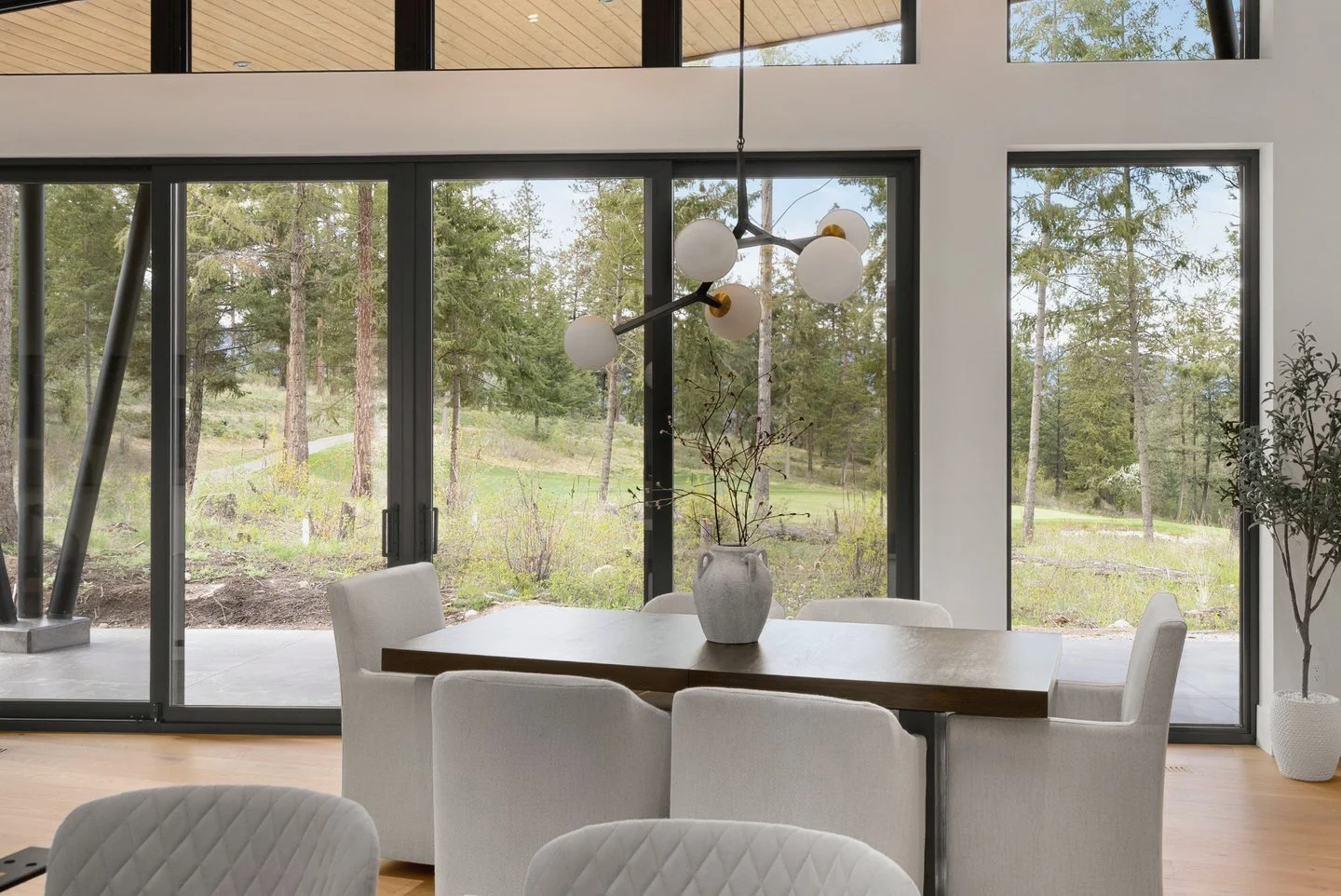 Dining area with sliding glass doors to the patio and the forest, Fairway Rancher, Predator Ridge