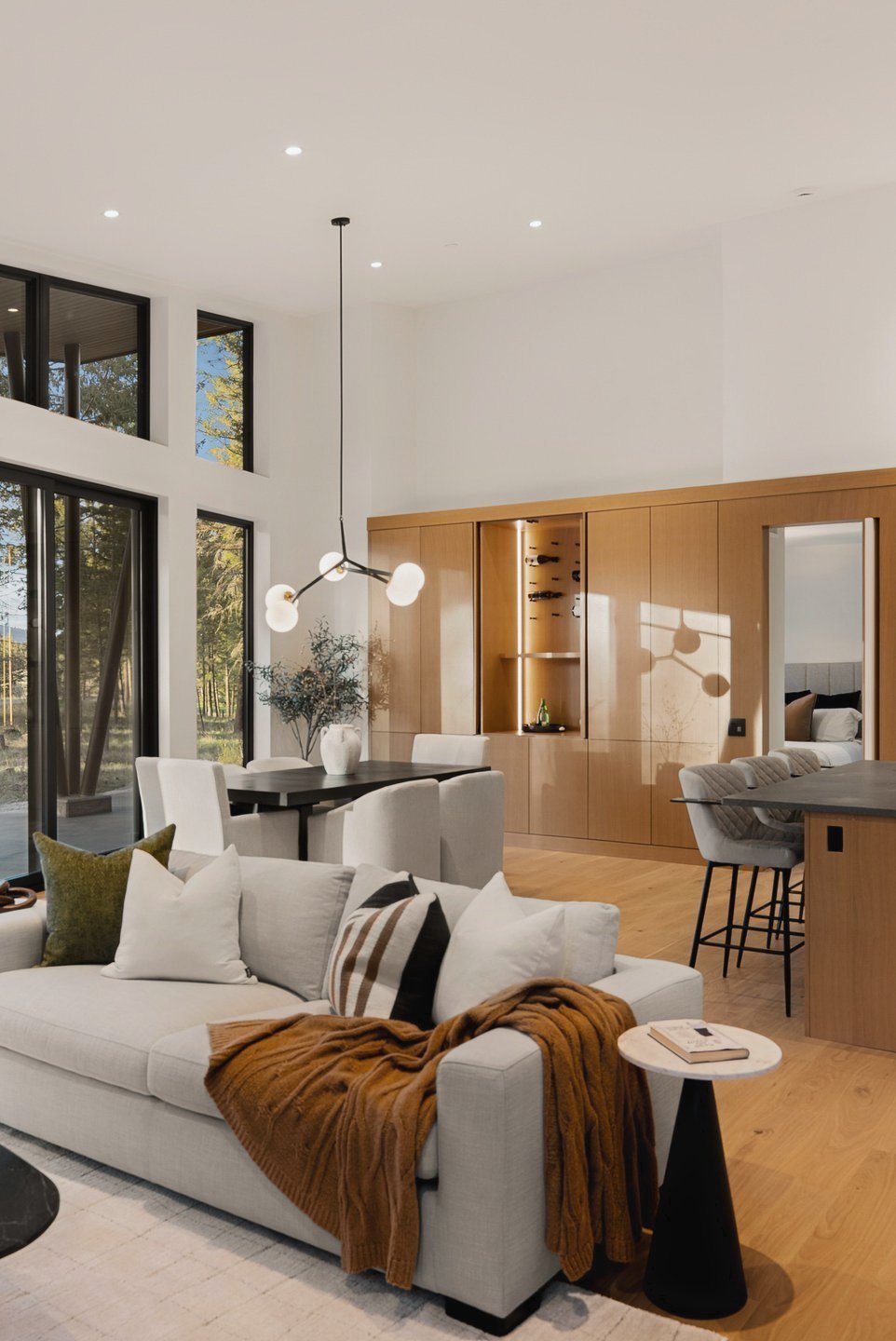 Living area with oak cabinetry and the dining table beyond, Fairway Rancher, Predator Ridge