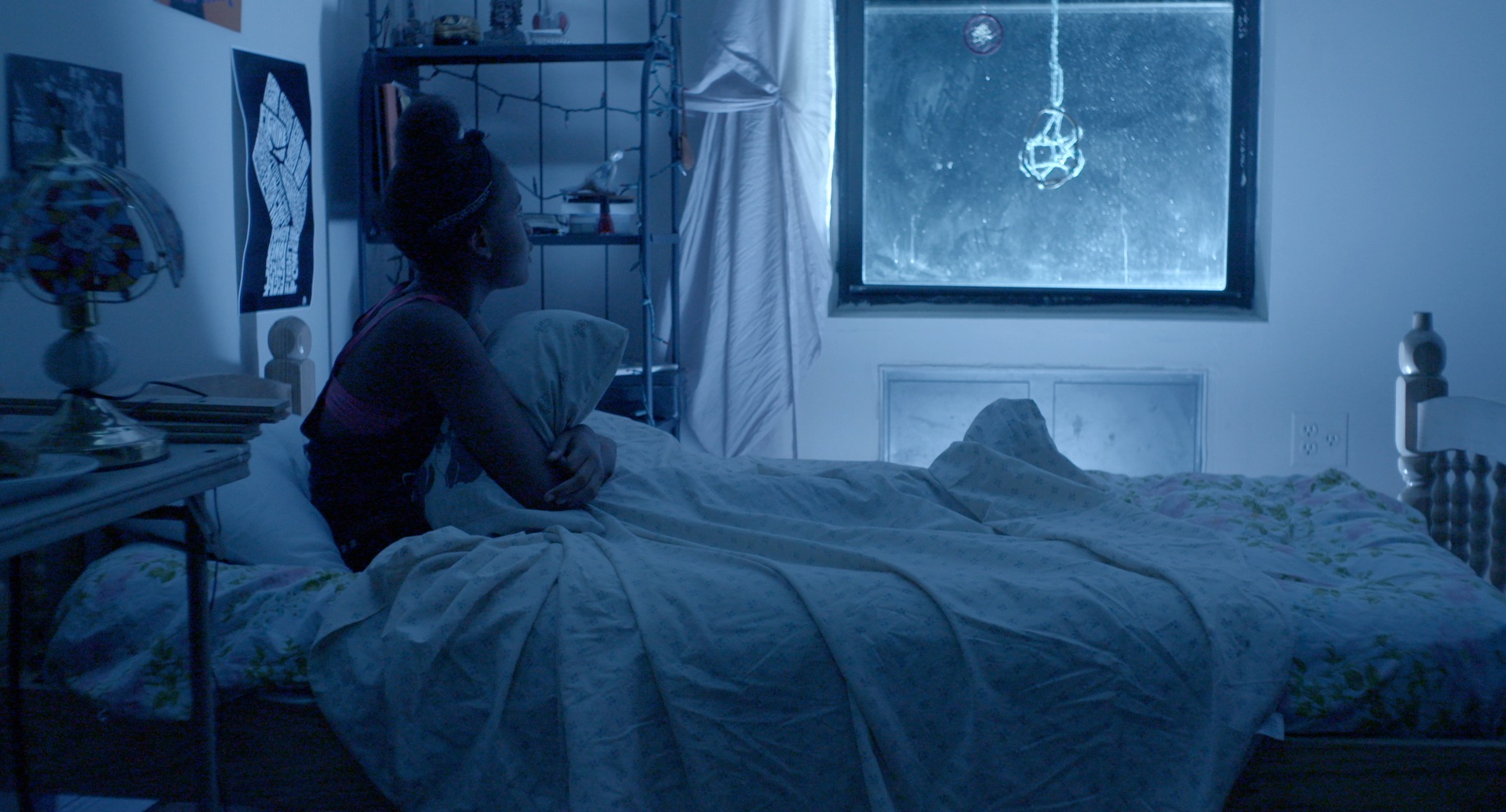  After Tilly's mom leaves the room, she turns off the lights and just the&nbsp;moonlight comes through. It shows Tilly coming back into the real world after checking out for a moment to reminisce with her mom.&nbsp;The dreamcatcher prop was featured 