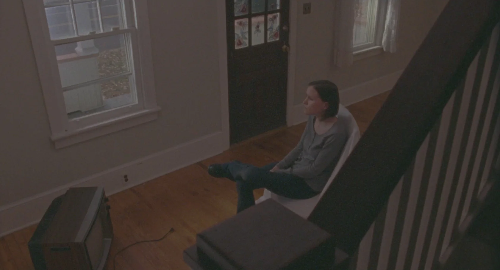 It was important for us to always find a camera angle that would evoke the character's mind state at all times. We felt that looking down at Anna in this lonely moment toward the end of the film helped to show how little relief she got from battling her sister over their mother's house. Getting the railing in front of her gave us some distance to disengage a little from their heated argument and look more at what, if anything, they really accomplished.