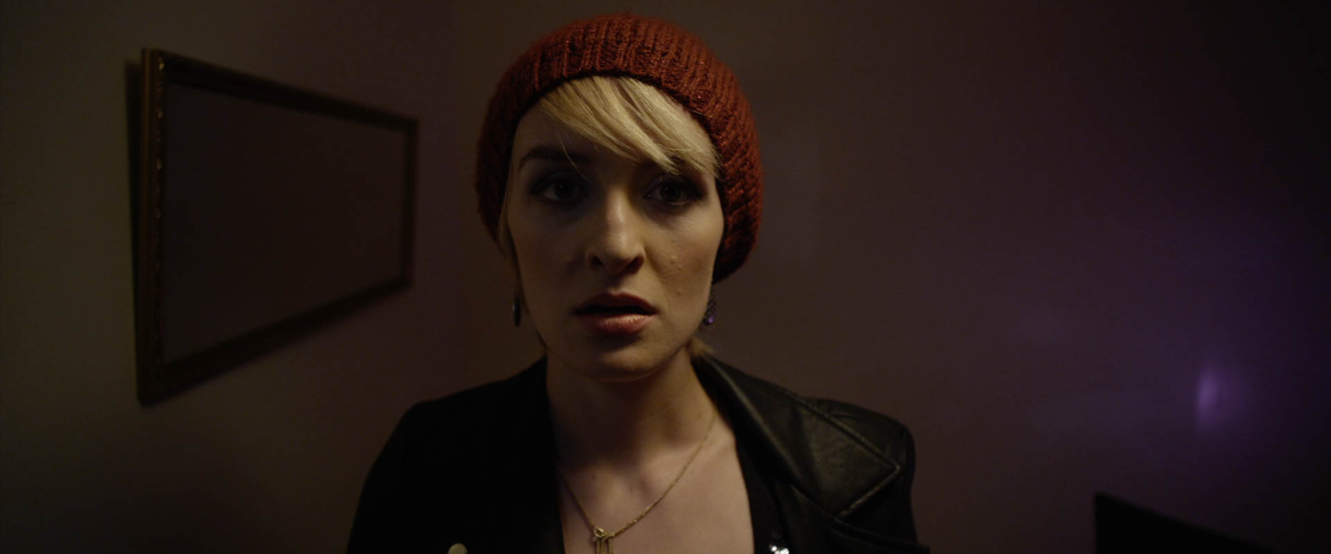 This was a fun scene because we got to introduce the eccentric French woman character (Christelle) who would come into our main character's (Luke) home and throw him for a spin. We wanted to set up the scene as if anything could be on the other side of the door when Luke goes to open it, so I was really interested in this idea of lighting her almost as if she was some sort of villain by keeping her very contrasty and imposing. I chose the wide angle lens here because this is the moment when Luke slams the door in her face, the first time she tries to come inside. I thought it was only fitting that the camera should also be right in her face; and I think audiences can feel the difference.