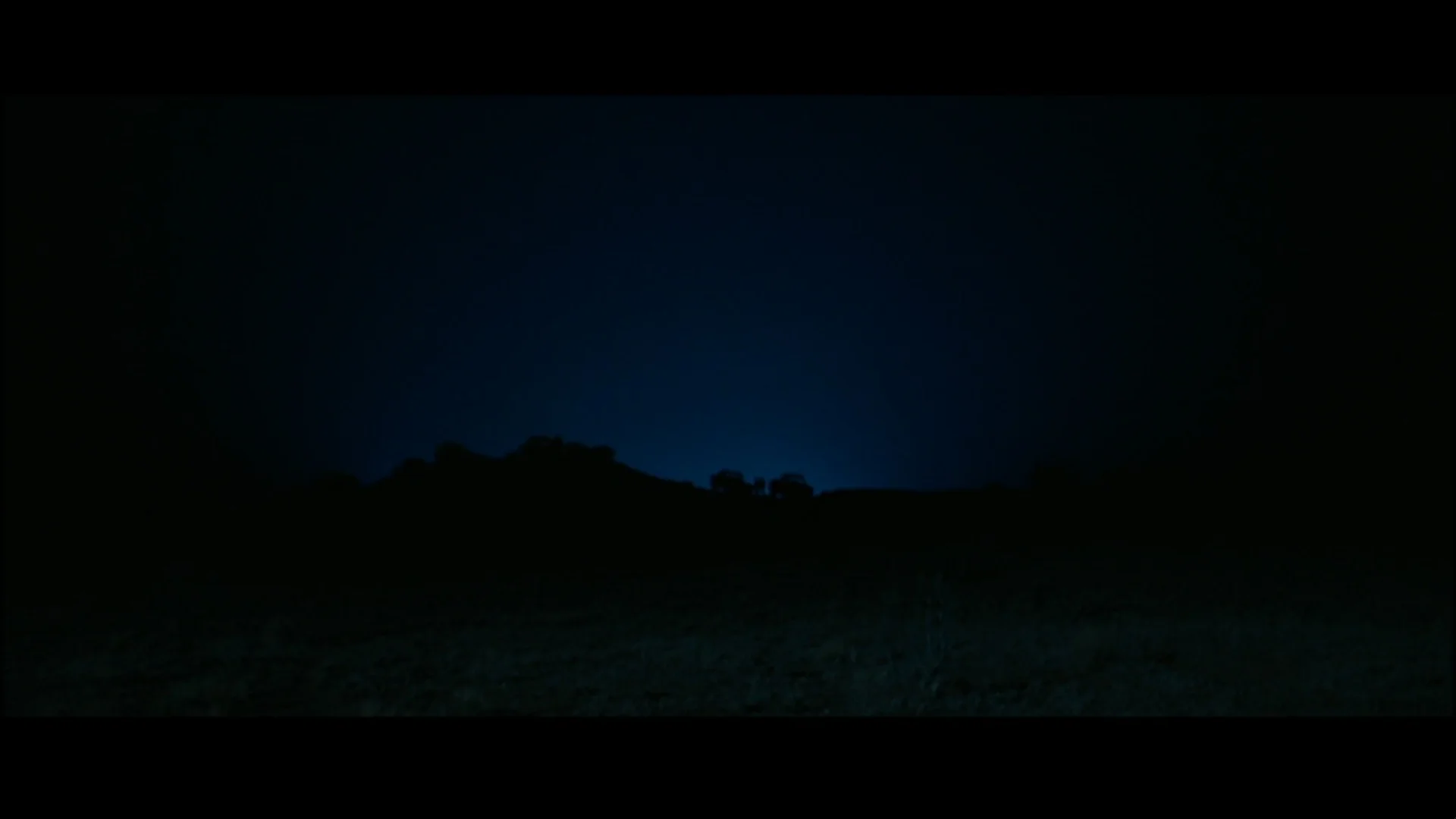 He lights dust to get the trucks in silhouette. P.S. Sorry for all the black bars :(