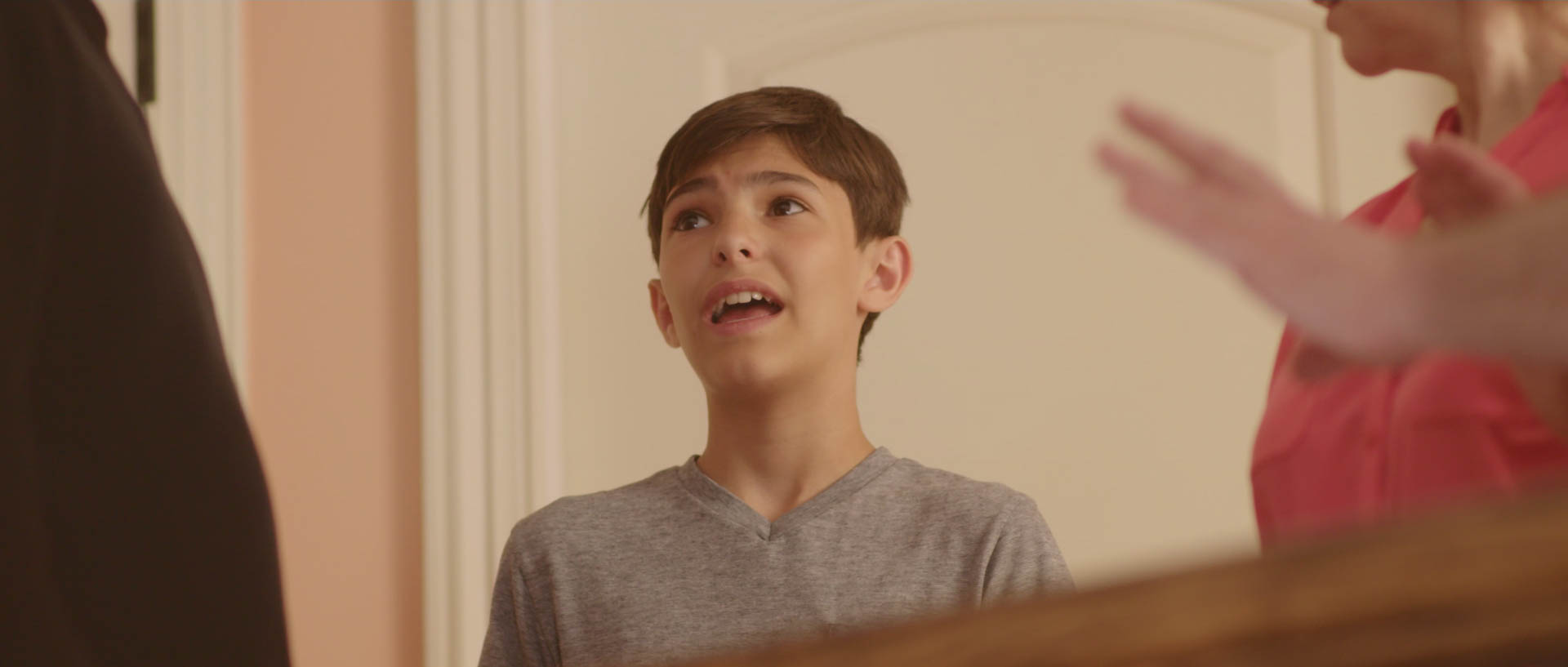 This shot shows again, the warmth that was available outside of Joshua's room in the hallway. We also have the camera down the stairs, which gives the impression that there's something else down there that we never quite see. 