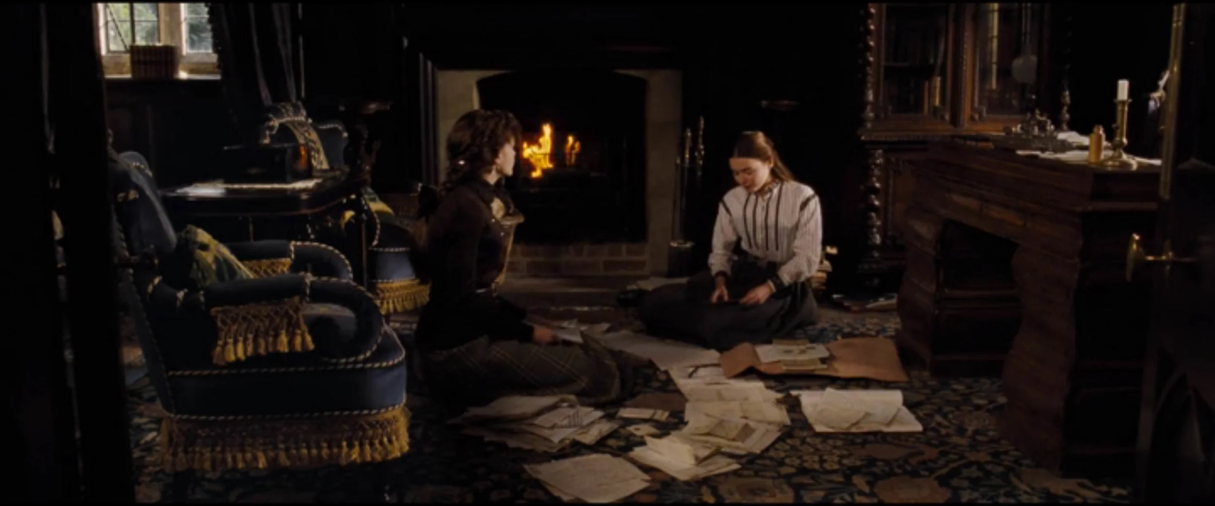 The light on the actors is definitely coming from within the room, but it manages to leave large areas of the background unlit.