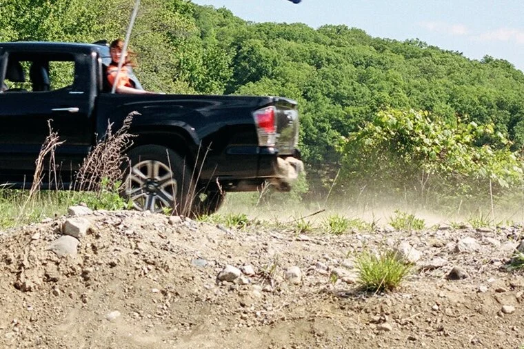 In this outtake you can see the dirt in the back and the blur on the character in the truck bed.