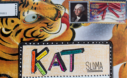 Mail art with the tiger licking the stamp