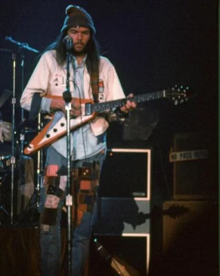 Neil Young wearing jeans patched by his wife, Susan