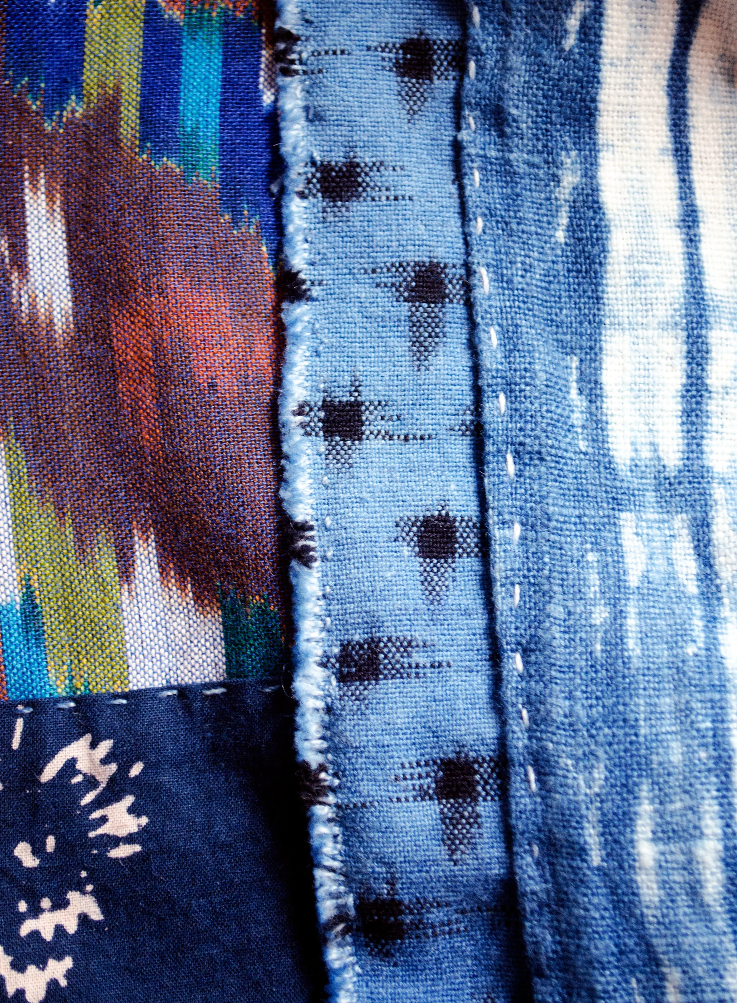 Hand-dyed cottons patched in the boro tradition.