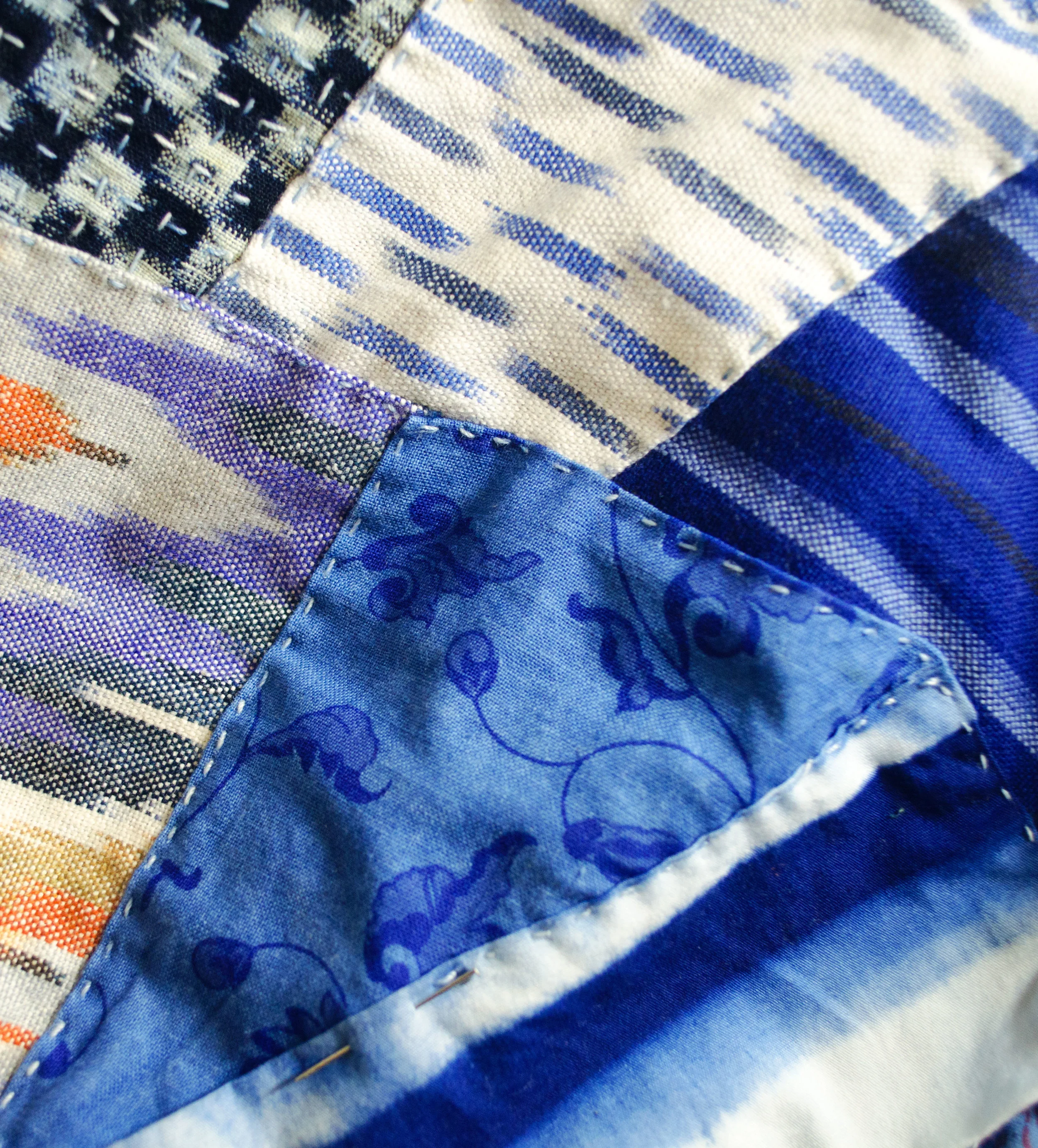 Shibori dyed cotton, overdyed indigo prints, ikat and woven stripes patched in the boro style
