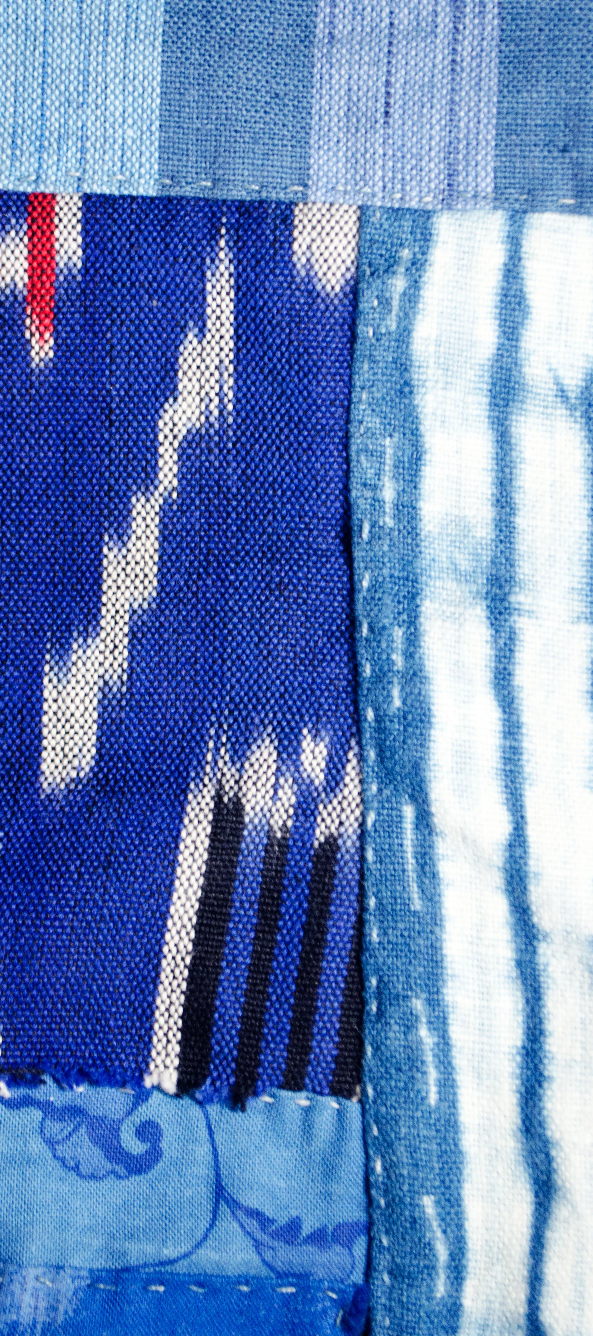 Handstitched shibori dyed indigo linen with ikat woven cotton 