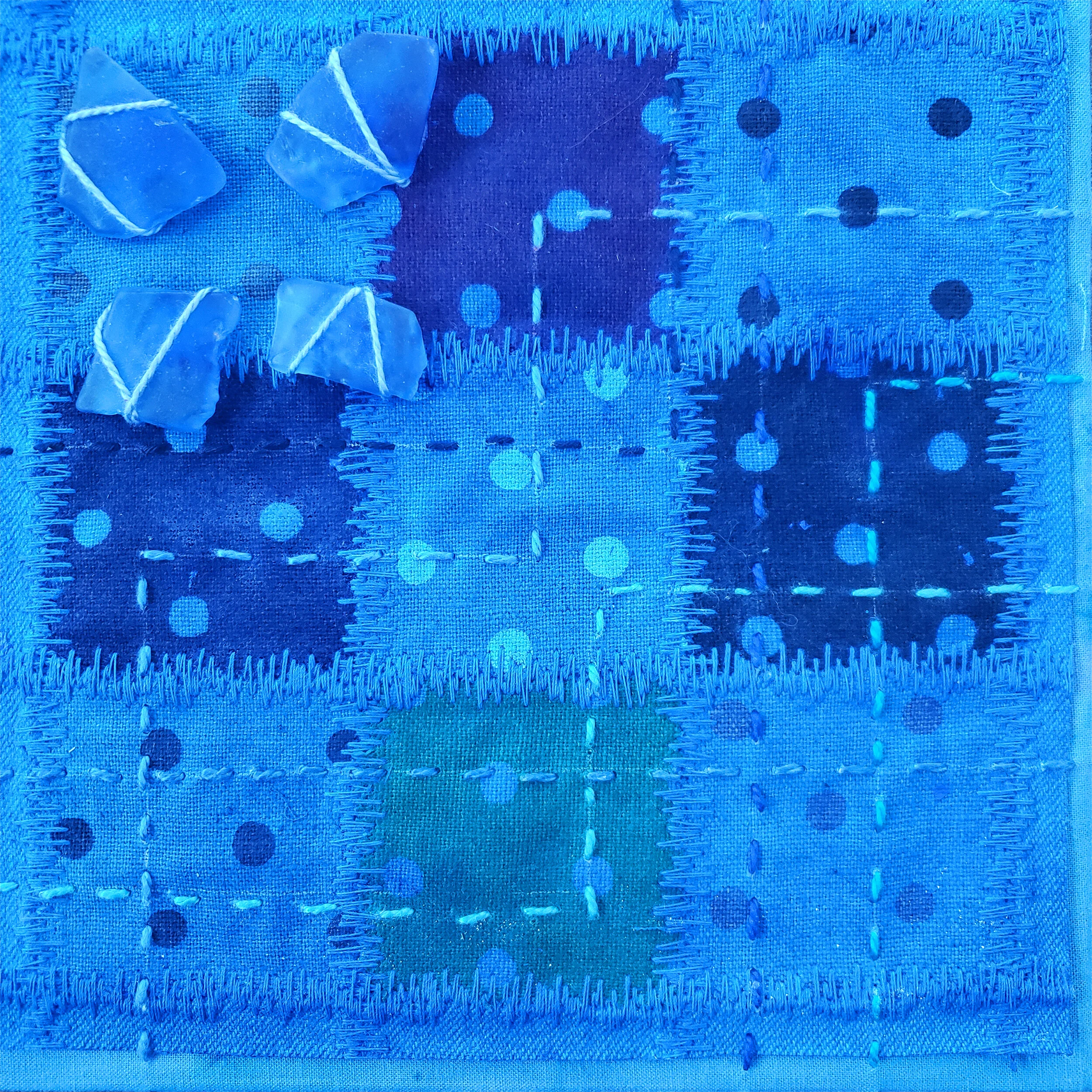  Held in Common: Blue #5  6” x 6” x 3/4” Indigo-dyed fabric, hand-stitched with scavenged sea glass, block printing, and industrial waste offcuts, laminated onto a Baltic birch plywood panel
