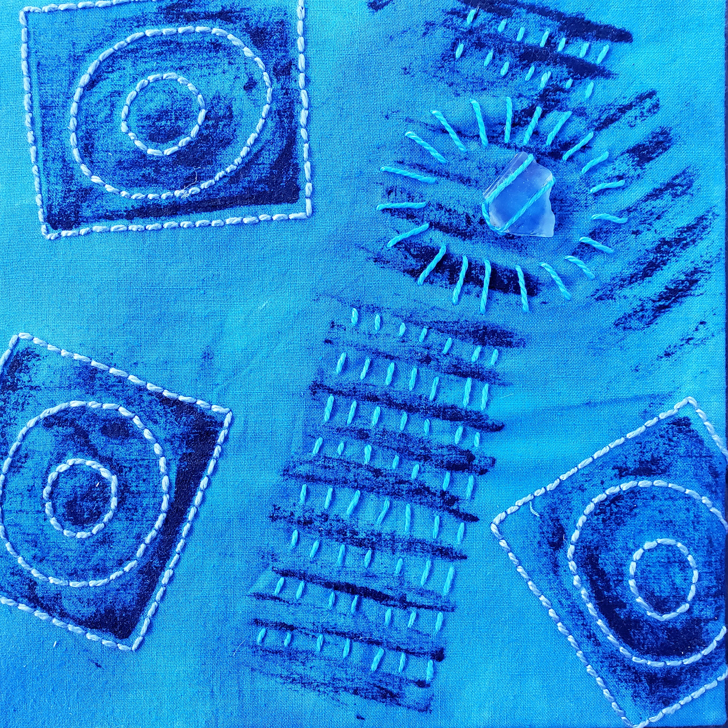  Held in Common: Blue #6  6” x 6” x 3/4” Indigo-dyed fabric, hand-stitched with scavenged sea glass, block printing, and industrial waste offcuts, laminated onto a Baltic birch plywood panel