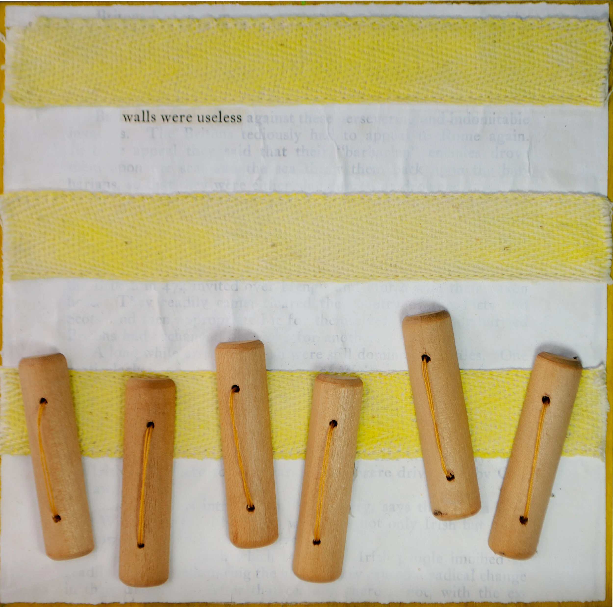 Held in Common: Yellow #14 by Carlyn Clark, mixed media art with yellow twill tape, wooden toggle beads, hand stitching, and revealed text