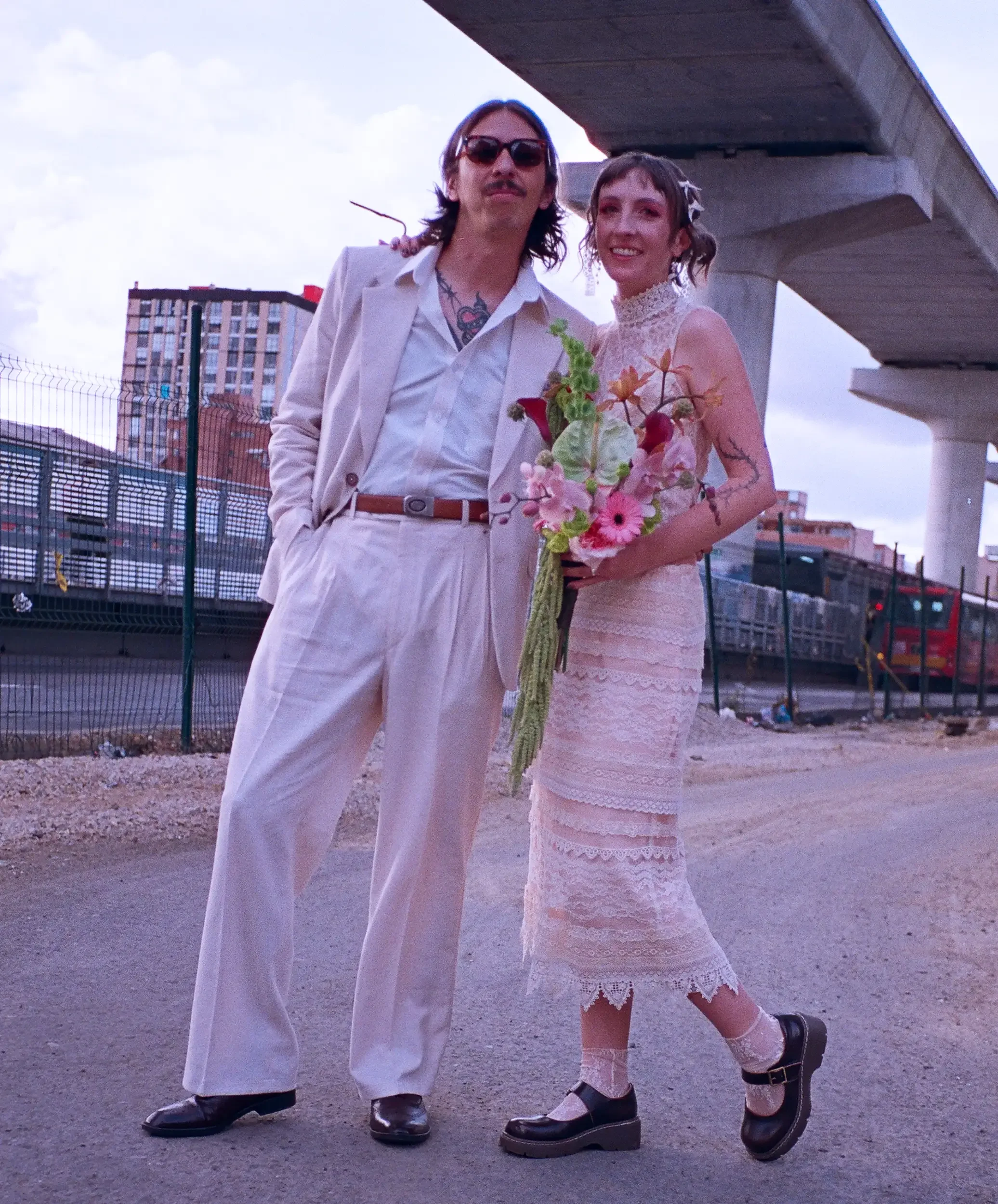 Hannah with her parents, wearing what her mom wore first — refashioned to fit her own day. Photo: Rou Rodriguez.