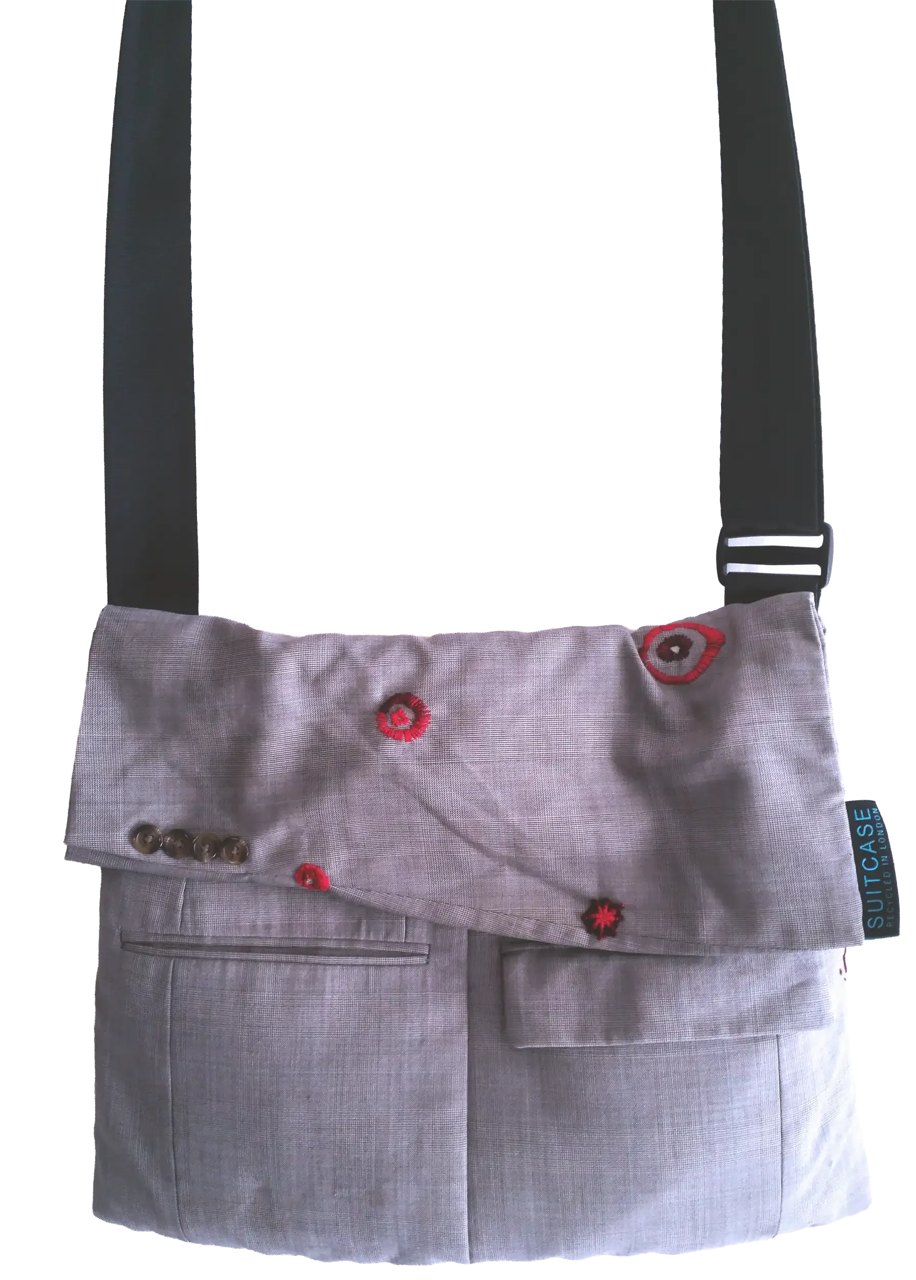 Grey upcycled wool suit crossbody bag featuring a folded sleeve-cuff flap with original buttons and visible mending in red thread across moth holes.