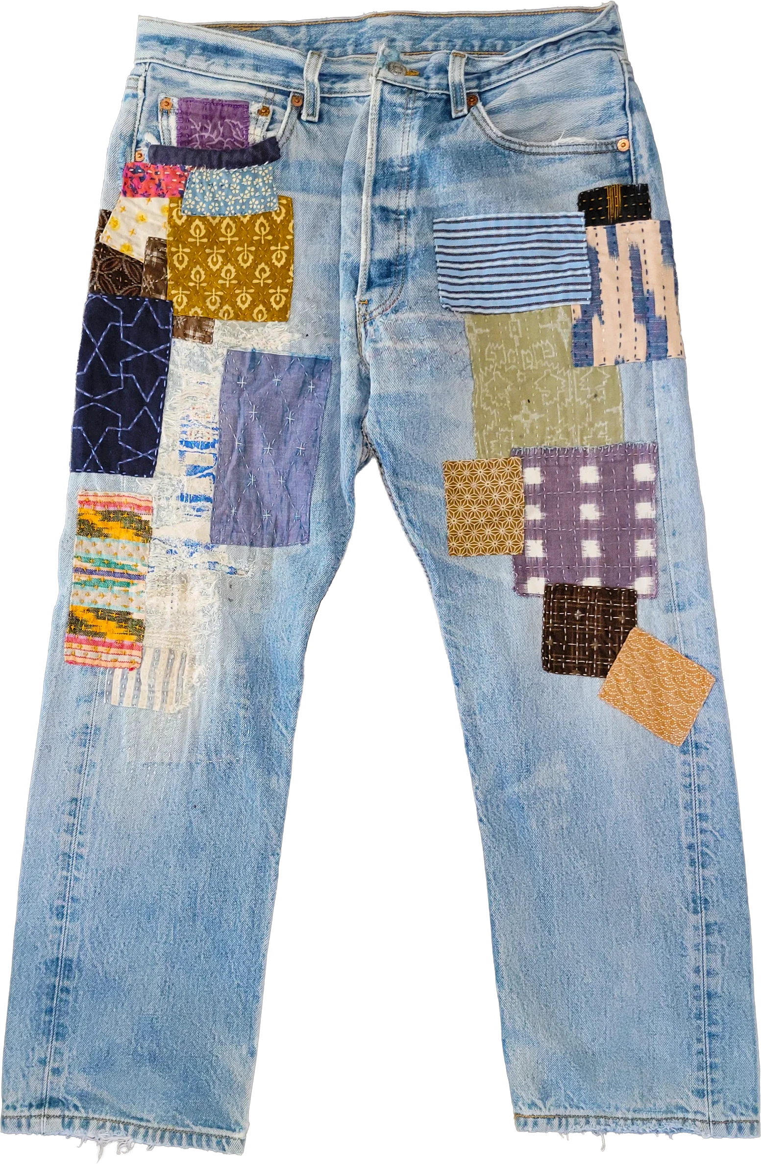 These vintage denim jeans carry their wear openly. Rather than hide the wear, I patched it — pairing indigo-dyed scraps, gingham, and salvaged prints with fine running stitches, star motifs, and hand-darning until each repair became its own small com