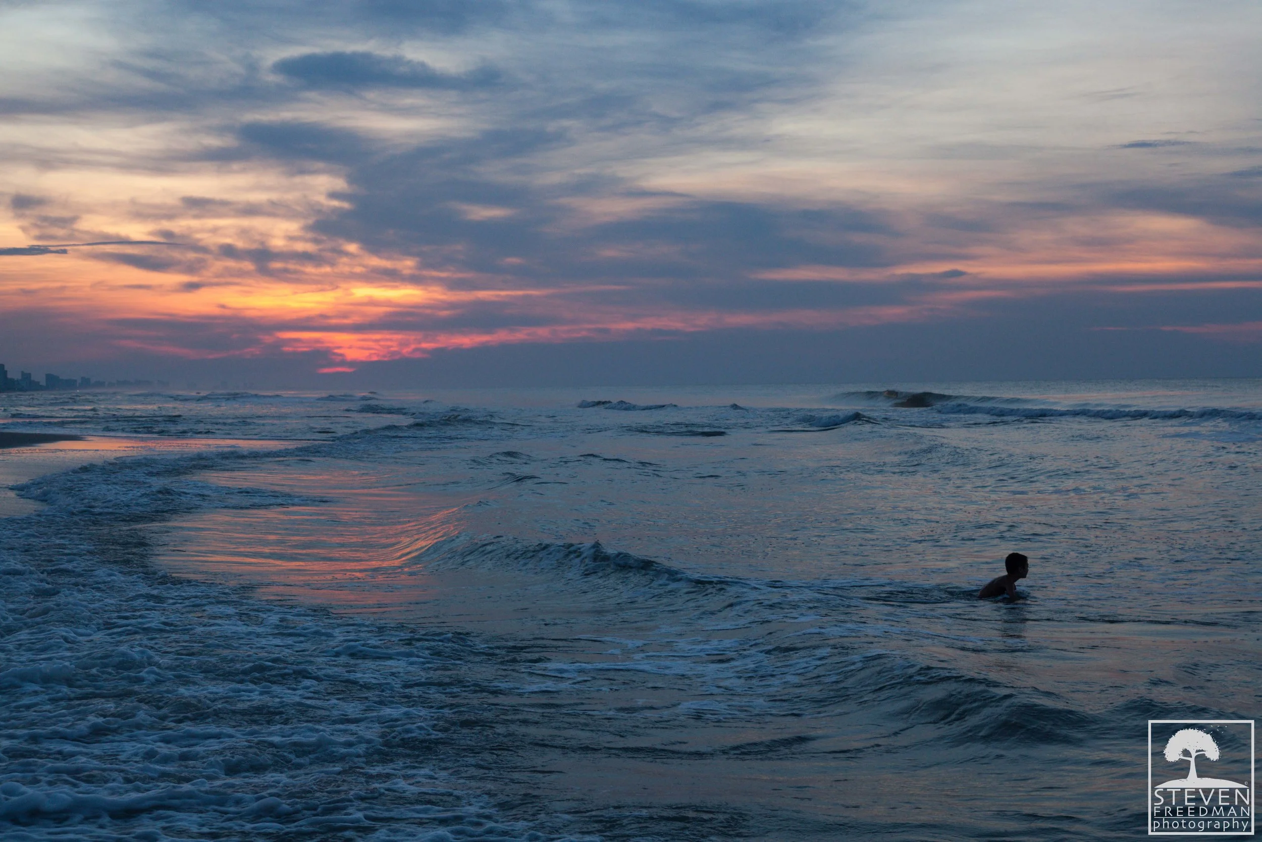 A boy enjoying the Atlantic for a dawn dip