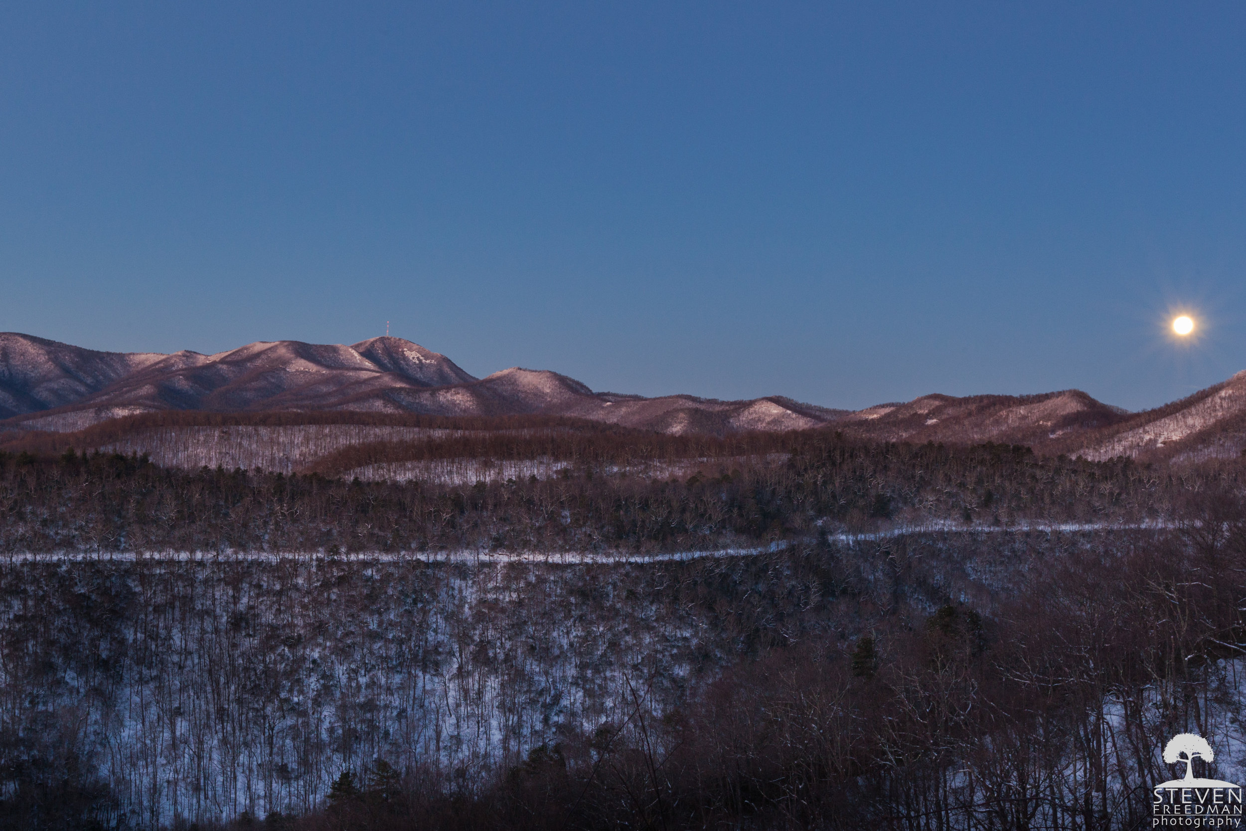 The Wolf Moon. The snow covered road in the middle of the frame is Wash Creek Road or Fire Road 5000 and leads down to the North Mill's River Recreation Area. 