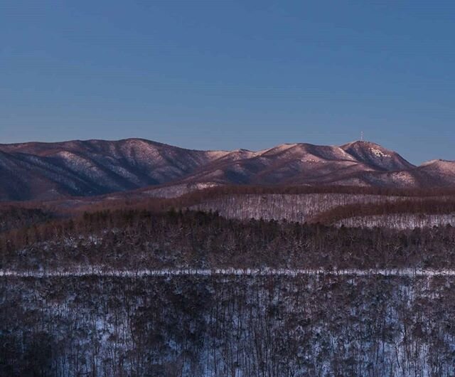 I took this photo on January 24, 2016.  Two days before it had had snowed 18 inches in WNC. The day before the wind was problematic for being outside but featured a full moon, The Wolf Moon.  I knew that Wolf Moon would be setting over Bad Fork Valle