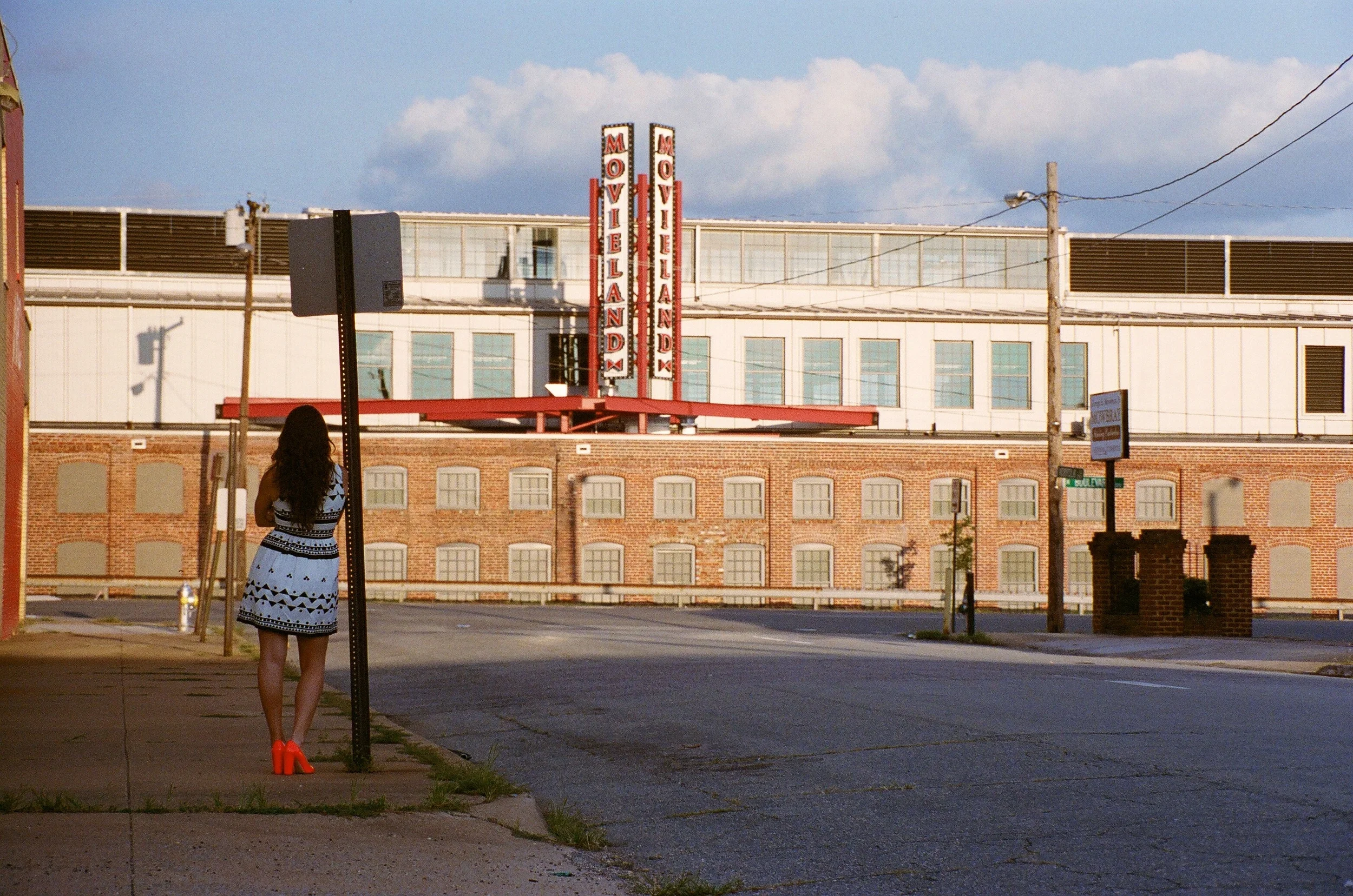  Photos taken in front of Bow Tie Cinemas Movieland on the Boulevard.  Cannon AE-1, film Portra 400.  Wearing:  J.Crew for days!&nbsp;  Dress //  J.Crew button-front dress in Roller Girl   Shoes //  Etta cap-toe satin neon persimmon pump   Earrings /