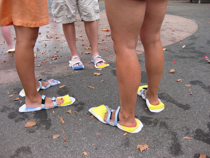 Participants in "River to Creek" wearing sponge shoes to replicate the experience of walking in the marshlands that once occupied North Brooklyn. C redit Carolyn Hall.