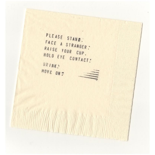 Hand-stamped cocktail napkin from Linger Longer Toast , a participatory public performance that took place in 2014. Credit Chlo ë Bass. 