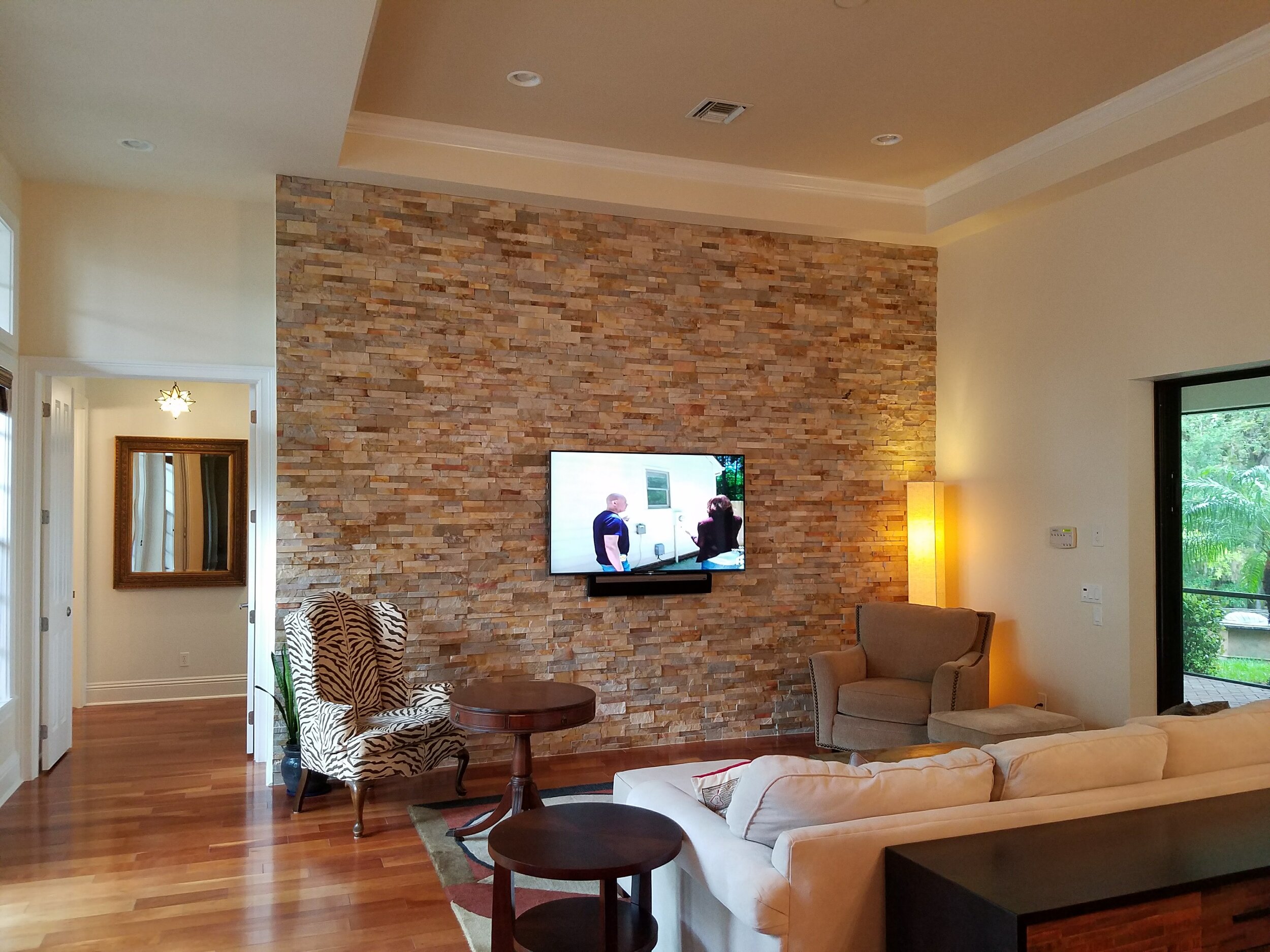 TV installed on brick wall .jpg