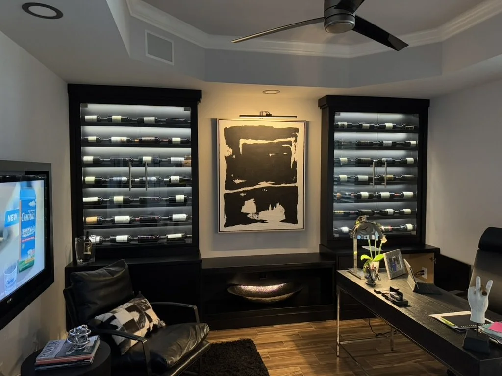 Artwork and wine bottles lighted properly.