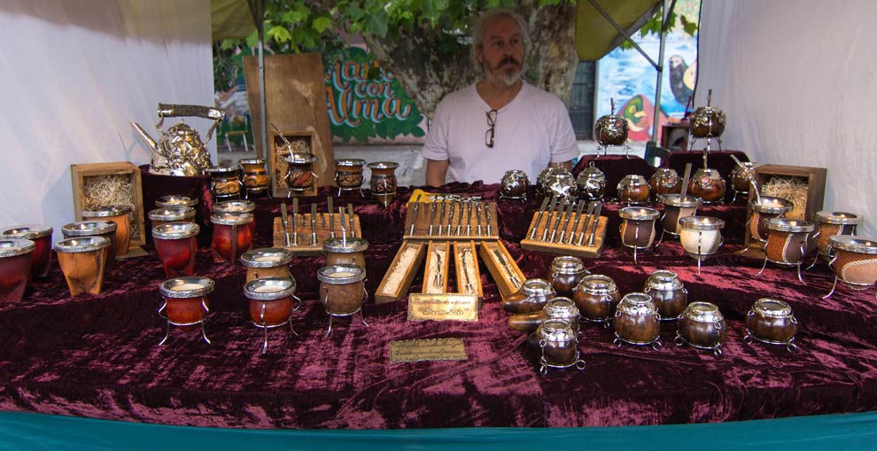 "Mate", aka "Yerba Mate" is the drink of the Argentineans. It is a daily, social ritual, sharing mate with friends is like having a cup of coffee in the States, or an afternoon tea in England. Mate is drank out of a specific type of gourd, and drunk through a metallic straw. This guy had some of the best setups Ive seen!