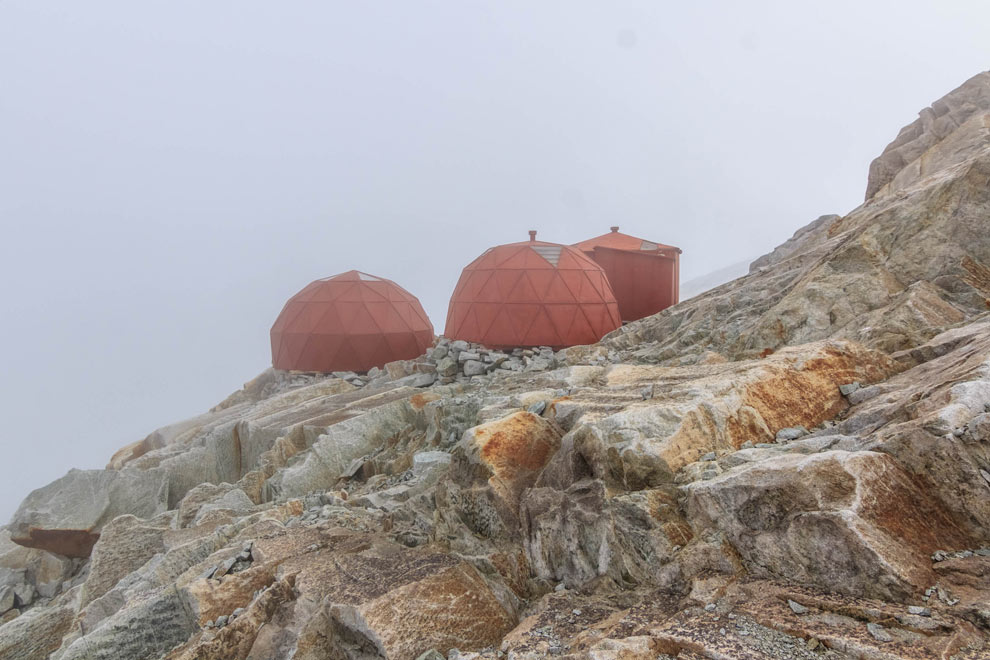 There she is! High Camp! Hangin' off the edge, right behind it is a massive glacier.