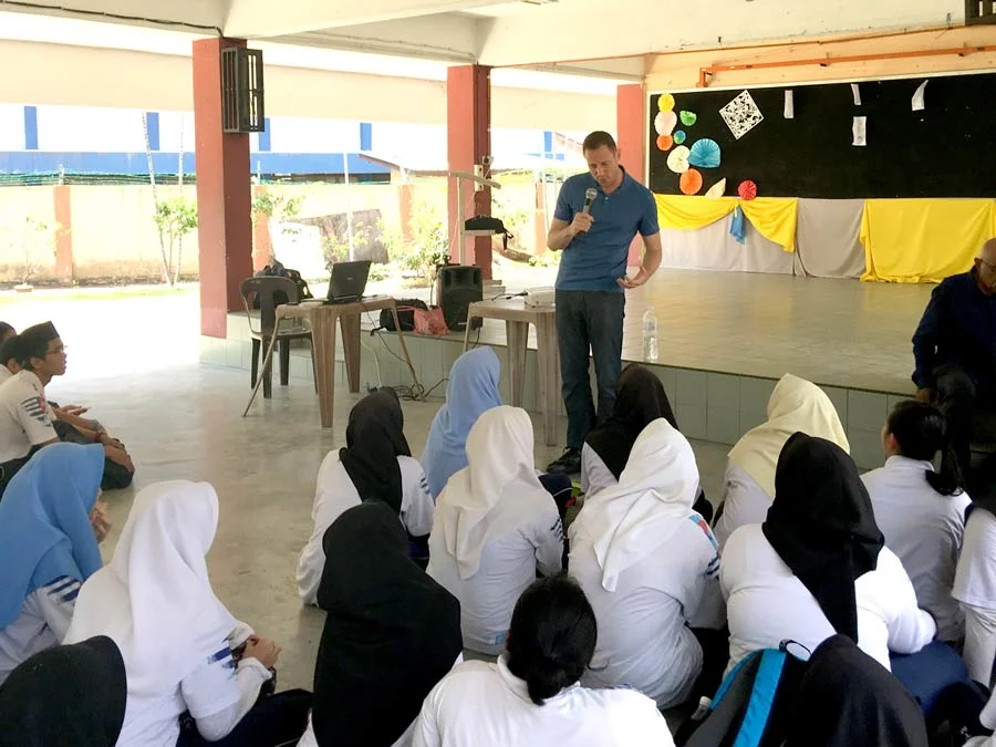 What am I doing here, demonstrating how to cradle a coconut?!!?!?