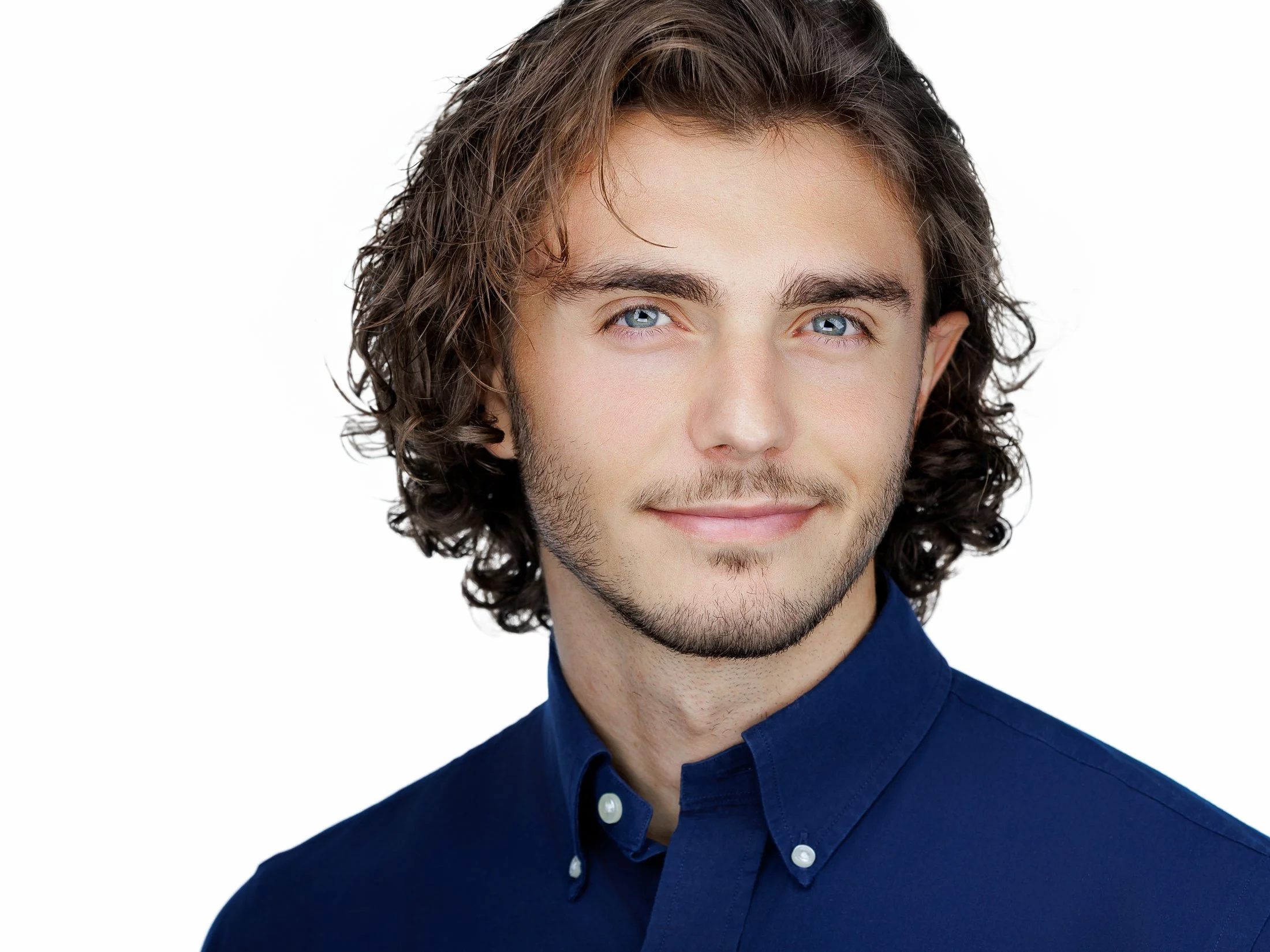 High-quality headshot with a white background, perfect for website bios and marketing materials."