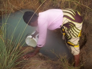  A women gathering water in Kabele. 