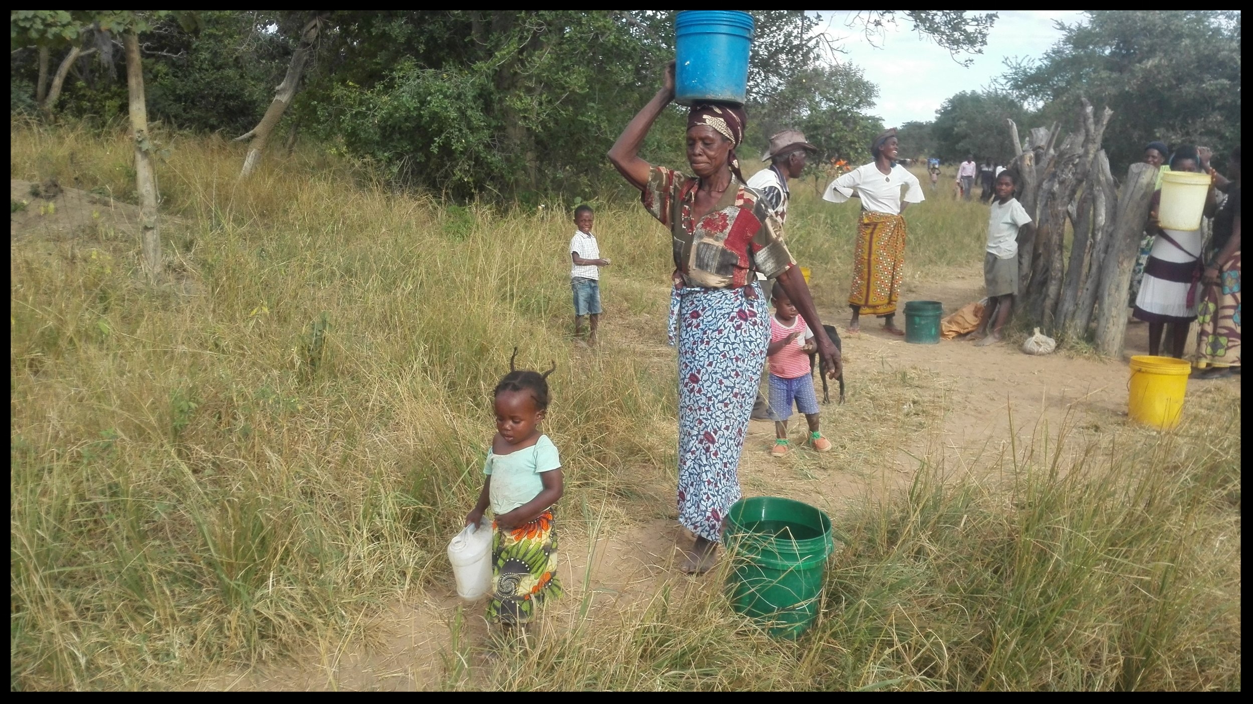 Happy Sibalwa villagers collect water from their new well. This well was built in the fall of 2016. The funds for these wells were provided by our wonderful donors in our Zambia 2016 campaign!