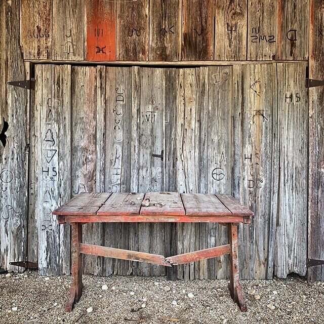 Branded wood on an abandoned blacksmith shop in The Grove, Texas.