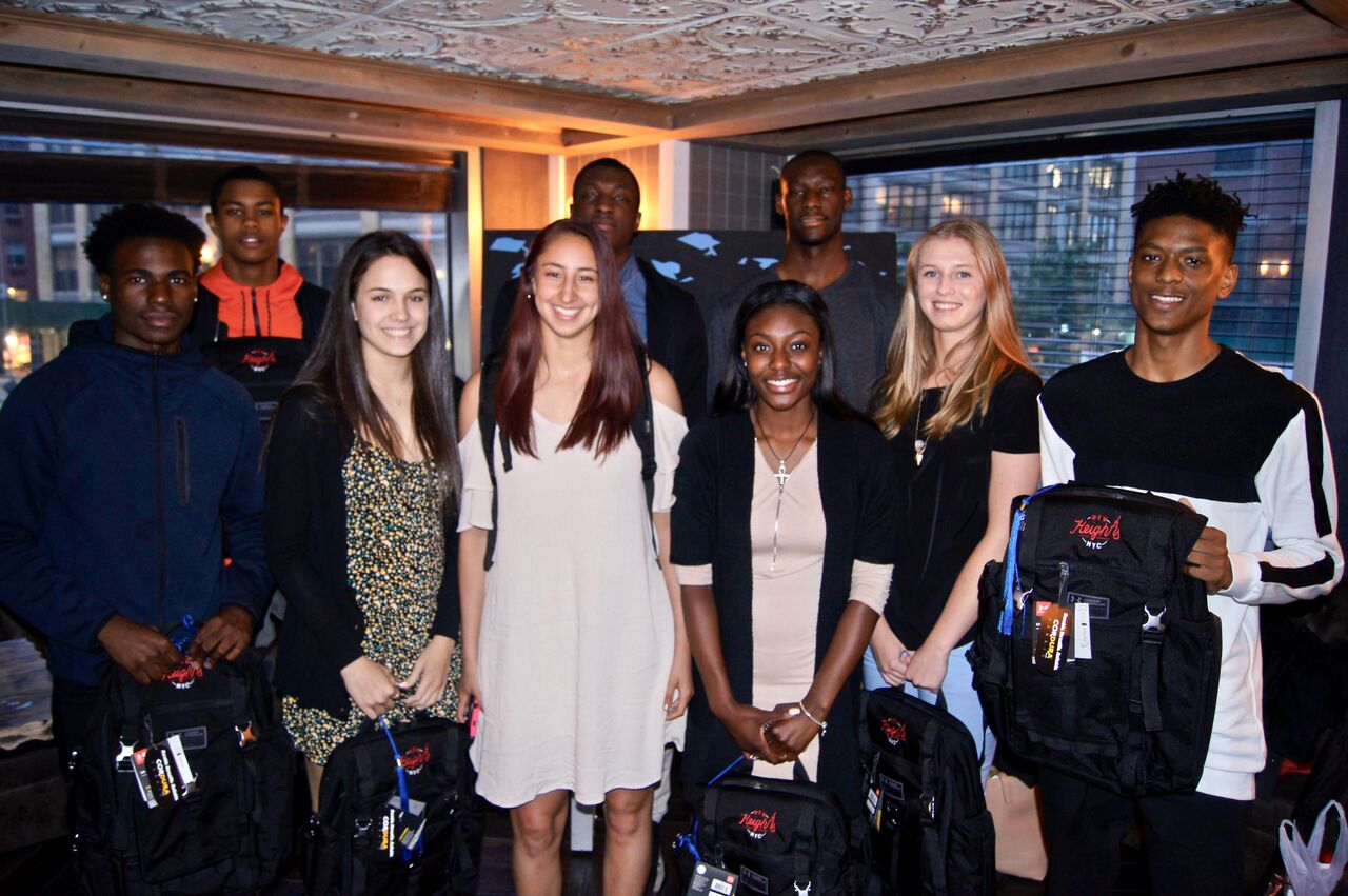 Seniors posing with their New Heights gifts