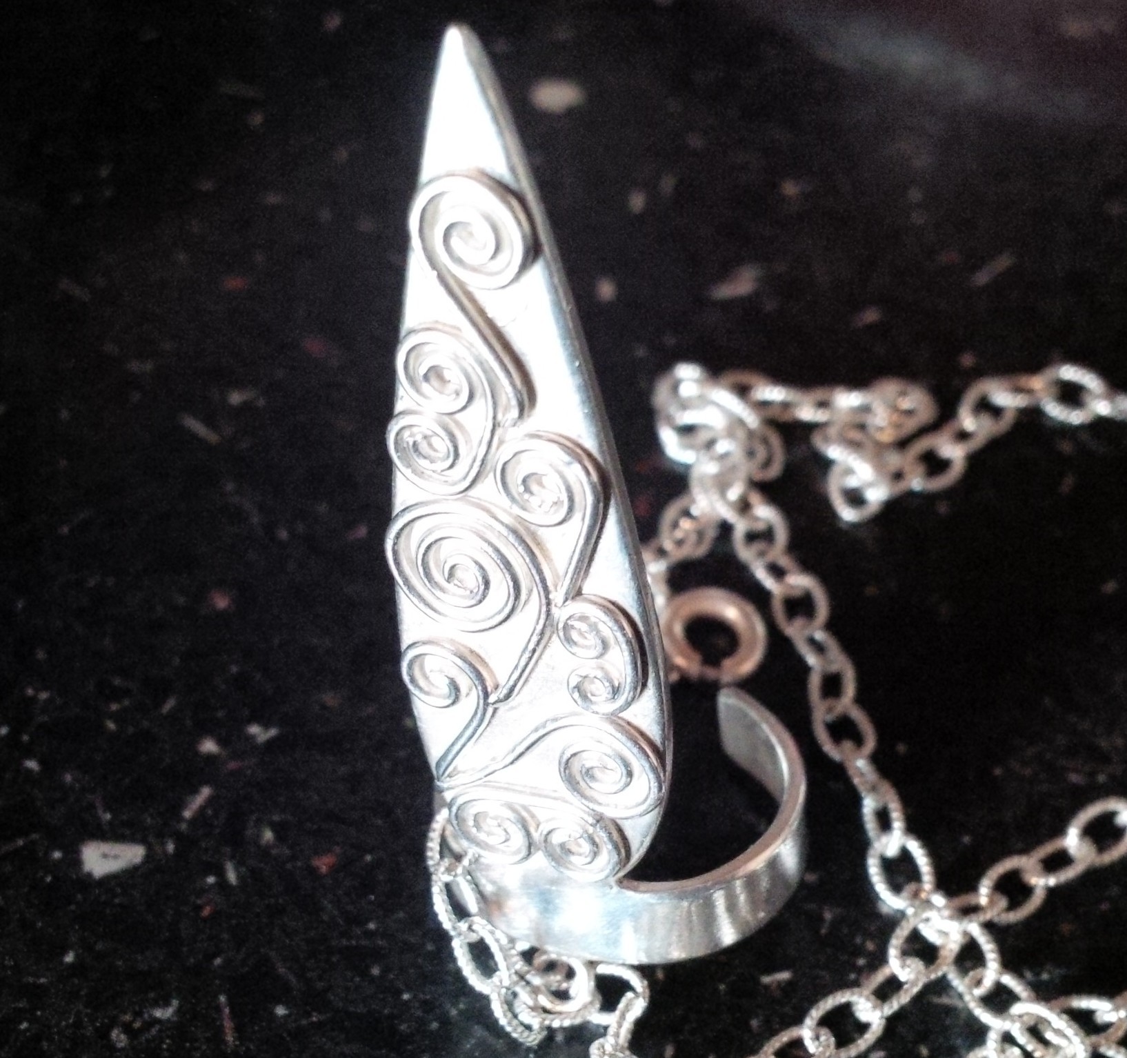 Pointed joined ring and bracelet with wirework detail