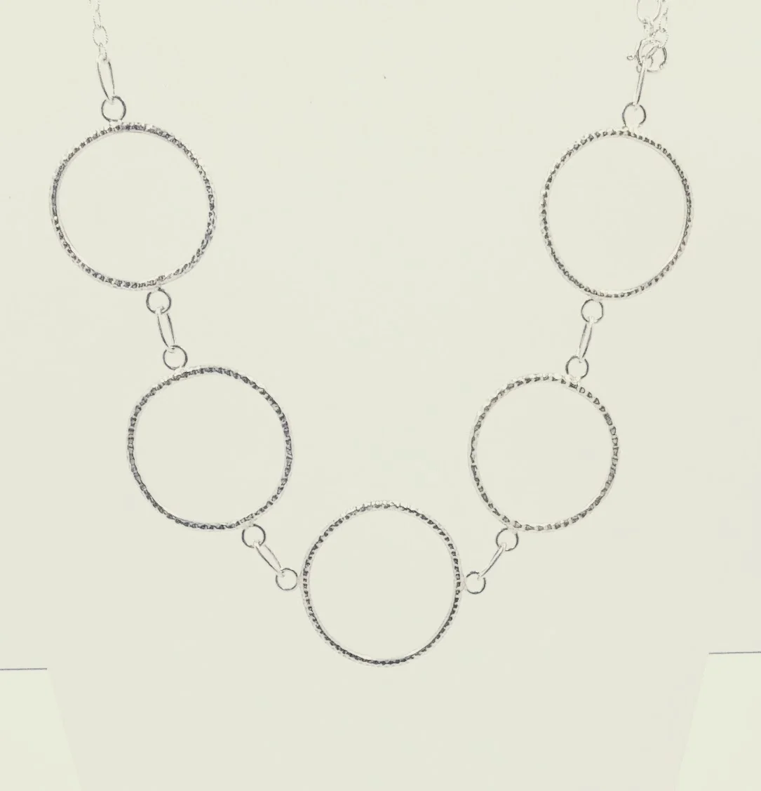 Large, silver necklace with textured, organic circles - BUY
