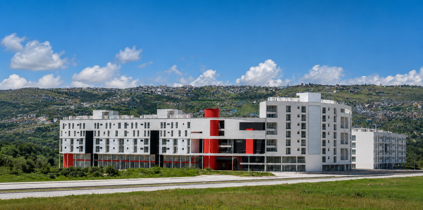 Cumbres de Quitumbe, fachada frontal del proyecto. uso del color rojo para resaltar elementos decorativos. Diseñado por Endara Arquitectos.