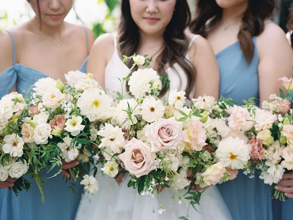 Bridal party holding lush garden-style bouquets at a Dos Pueblos Orchid Farm wedding in Santa Barbara.