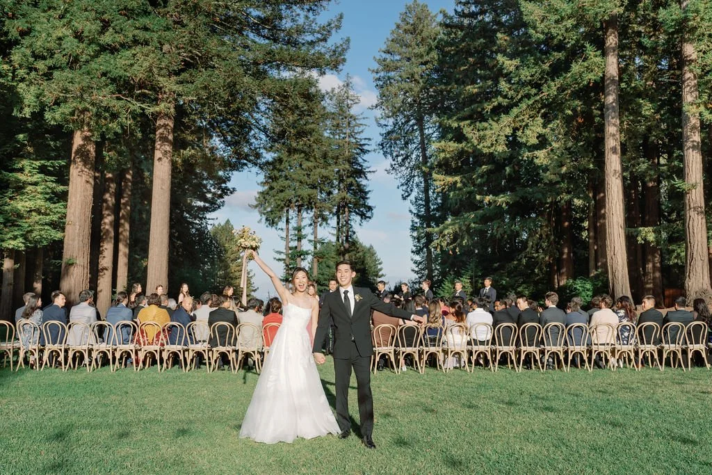 Couple celebrating their ceremony recessional at Mountain Terrace wedding venue.