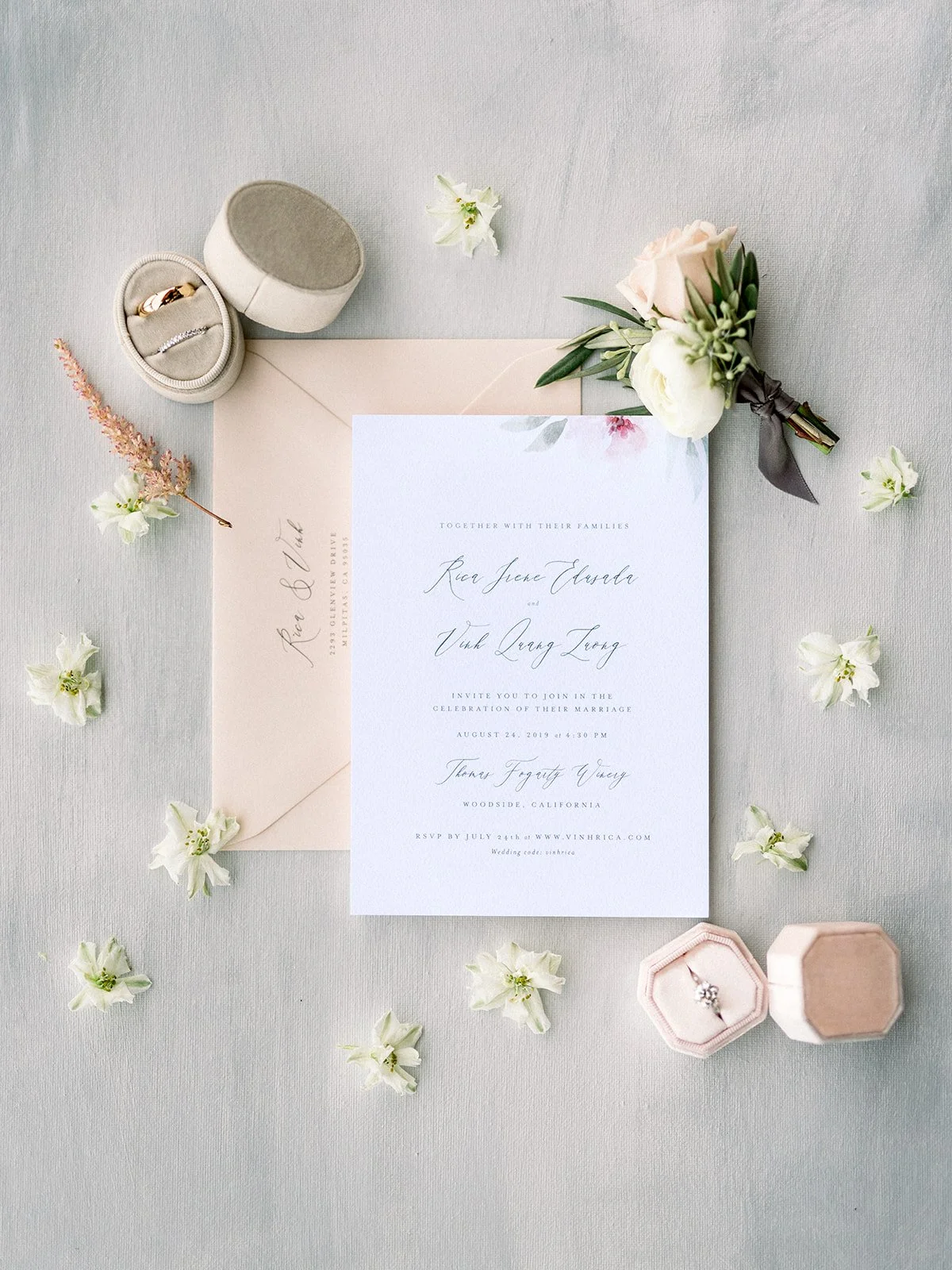 Luxury wedding invitation suite with rings and florals for a Thomas Fogarty Winery wedding.